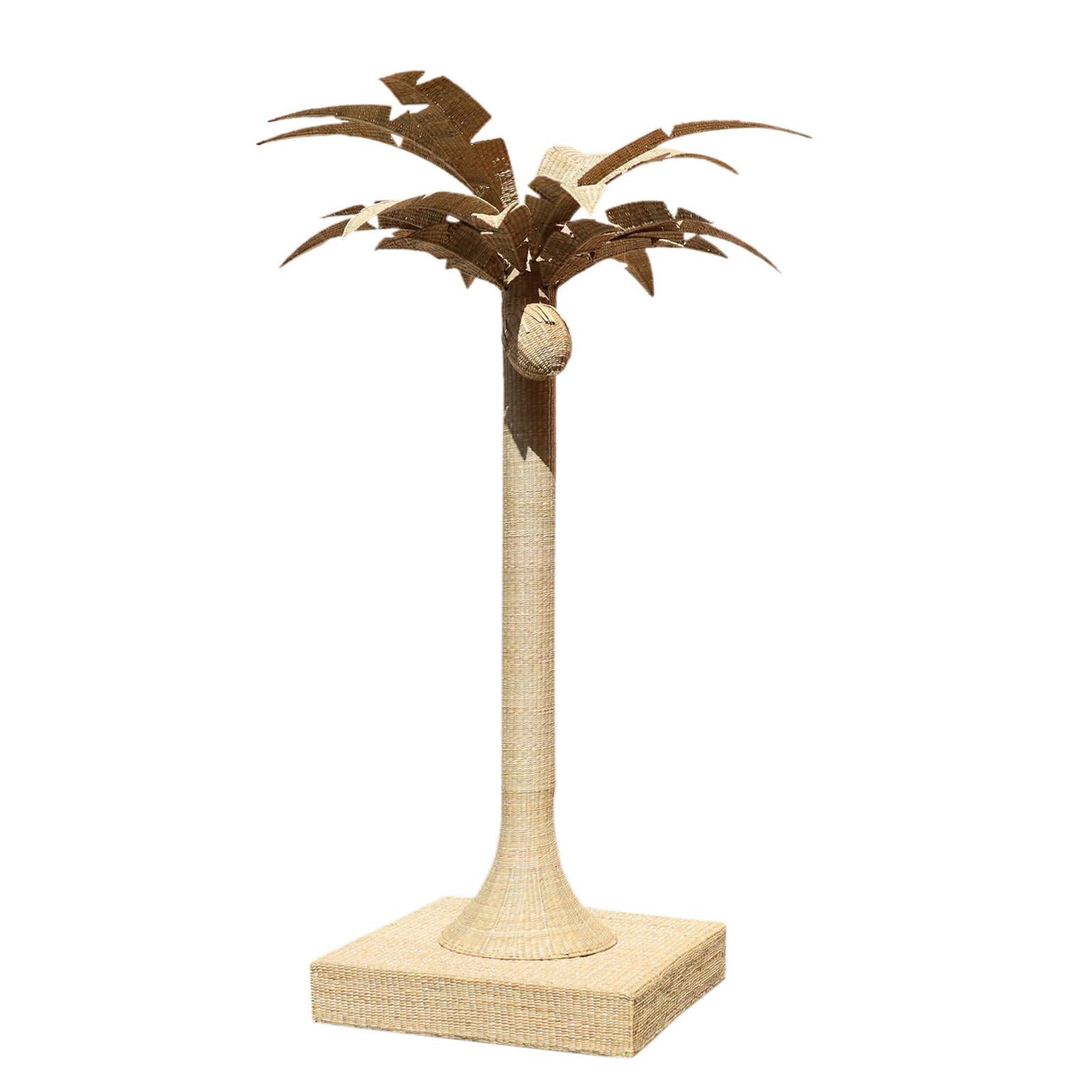 Life size sculpture of a palm tree with a coconut crafted in wicker or reed wrapped over a metal frame with impressive stylized presence. From the FS Flores Collection designed and offered exclusively by F.S. Henemader Antiques.