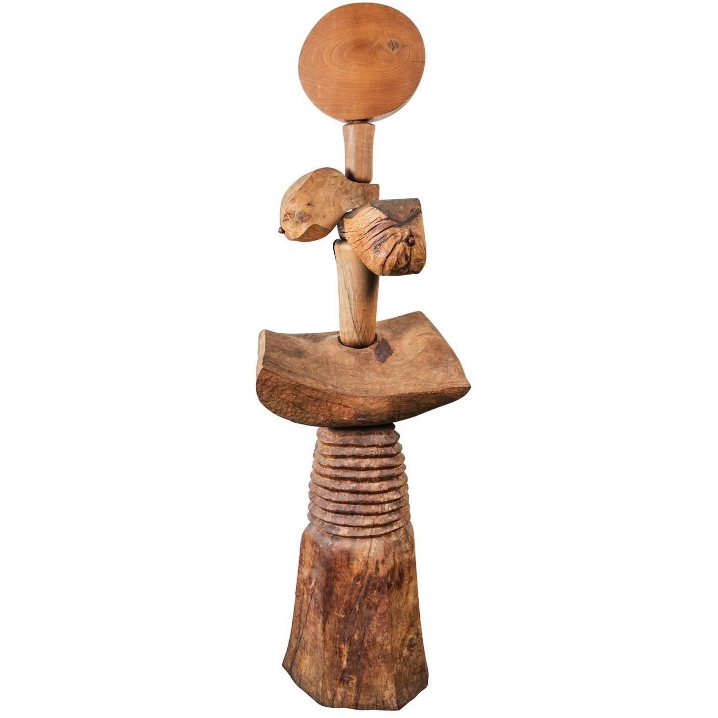 Remarkable, large, hand-carved, tribal-type, teak sculpture of an abstract, female form featuring a mix of refined and rough finishes.