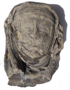 Limestone head of an abbess circa 1400