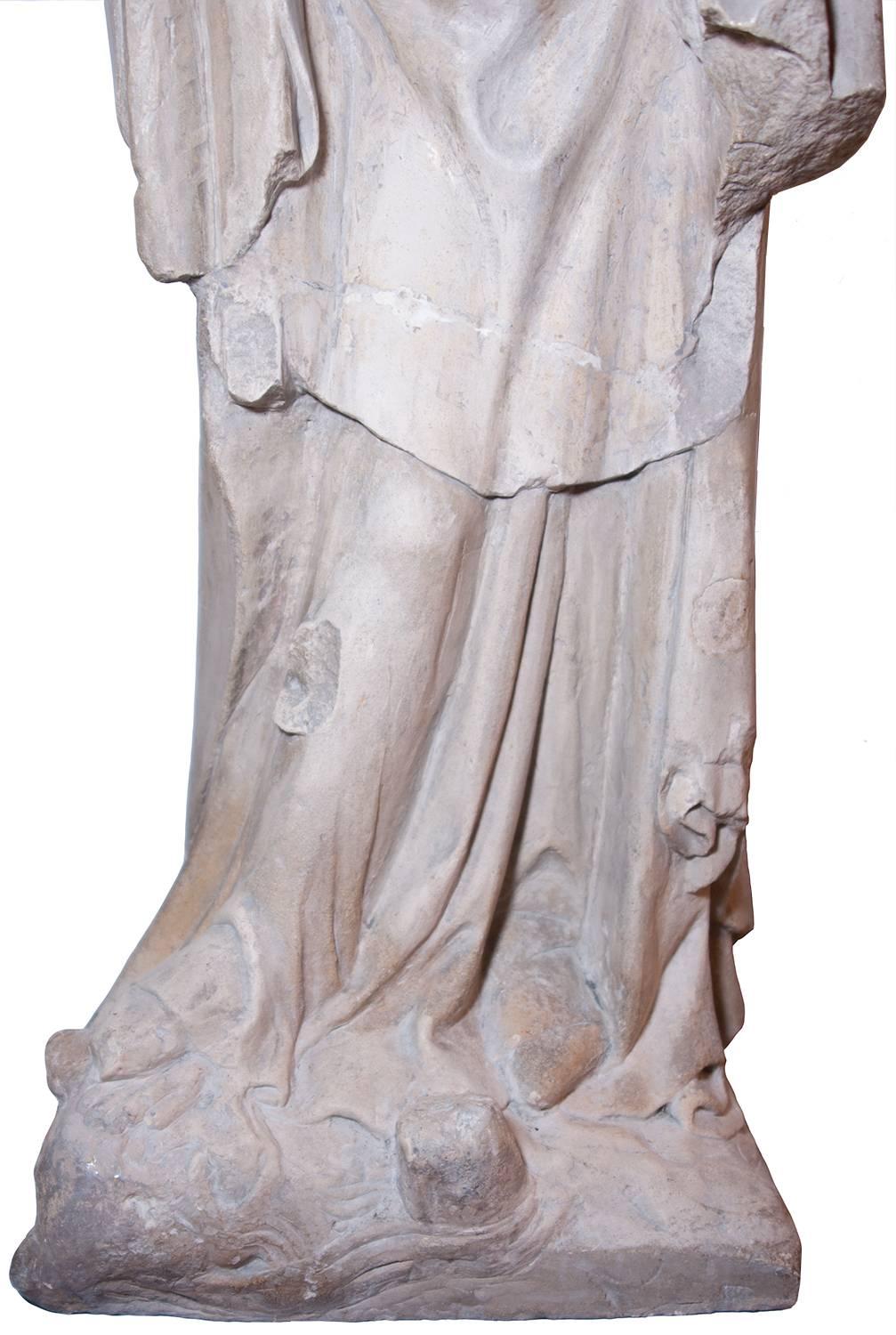 Limestone statue of St. Catherine, early XIV th century - Medieval Sculpture by Unknown