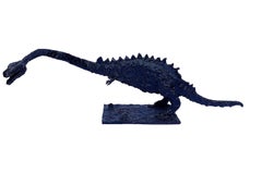 Long Brutalist Steel Dinosaur, slender with rust and tar-like finish