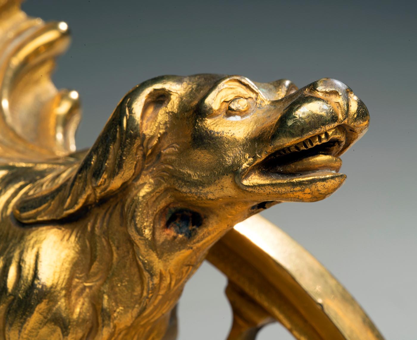 Louis XV-Style Gilt Bronze Chenets With a Poodle and a Hound - a Pair
France, 19th century 
Gilt bronze
11 x 4 x 10 inches

Chenets, also referred to as fire dogs and andirons, are metal supports for logs in the fireplace, usually with two feet at
