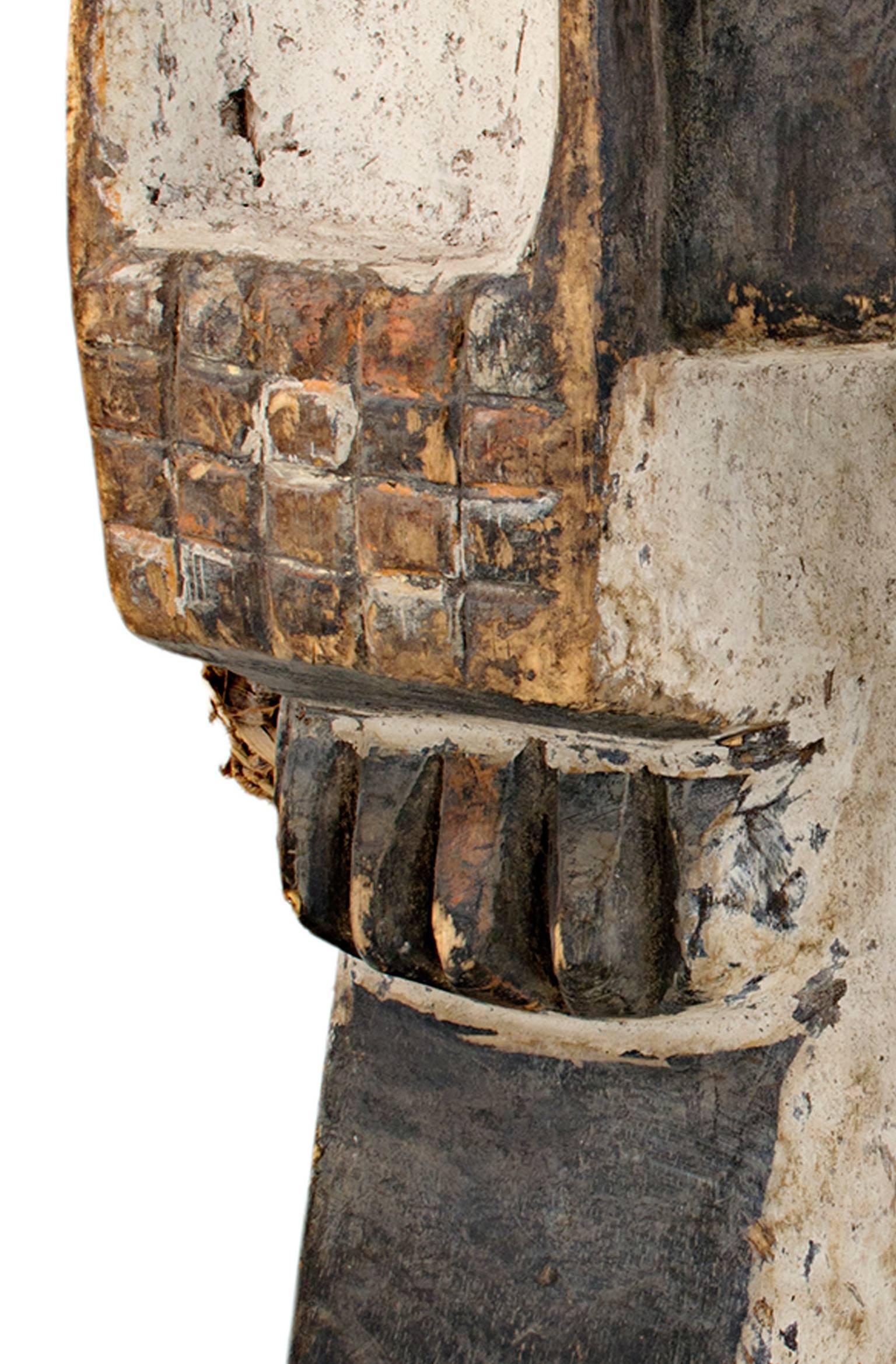 This mask was created by an unknown artist from the Waawa-Igbo tribe of Nigeria. It is made of wood. Amongst the Waawa people there is a lot of cultural diversity, and each locality can be identified by their unique style of music and cultural