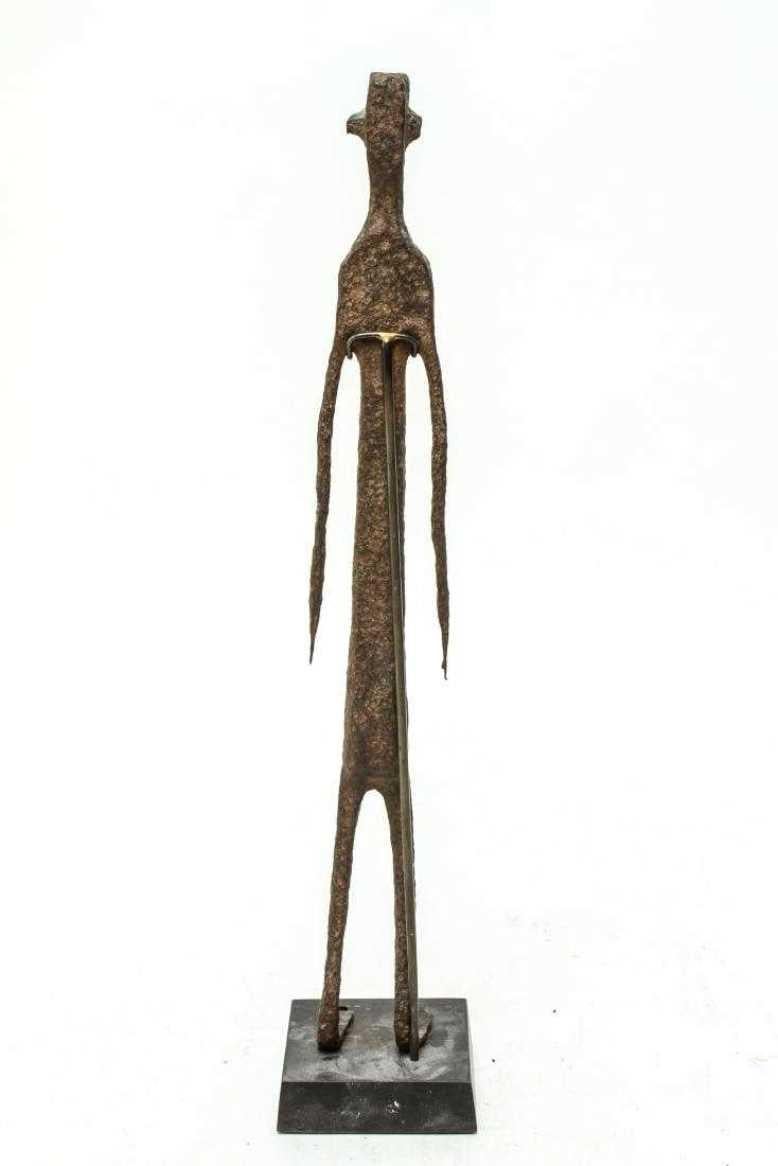 Unique and original Sculpture of 'Man Standing' , apparently unsigned.

It is possible that this art work reminiscent of Giacometti most evocative sculptures is a much earlier work from the Bambara people of West Africa..
A fine  evocation on the