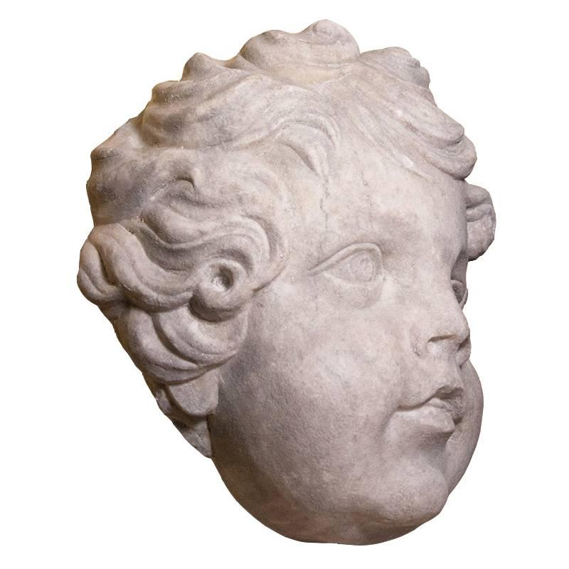 Marble head of a putto, circa 1700  - Sculpture by Unknown