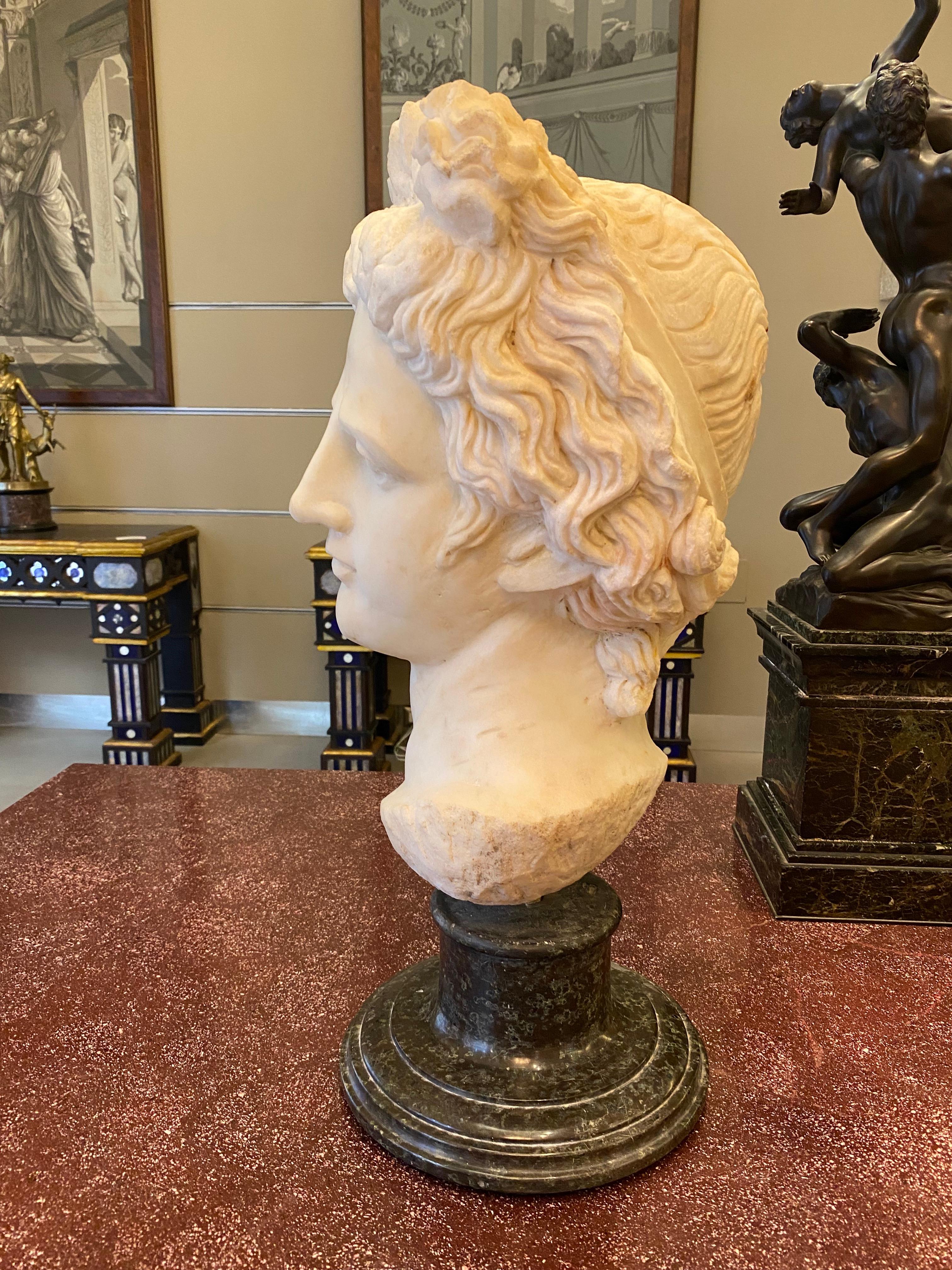 Finely carved mythological subject in white Carrara marble  of Apollo head  .
