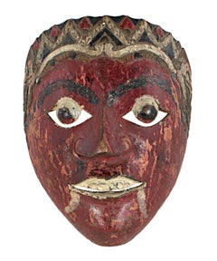 "Mask with Round Eyes, Painted Fangs, and Blood Red Face, " Wood from Indonesia