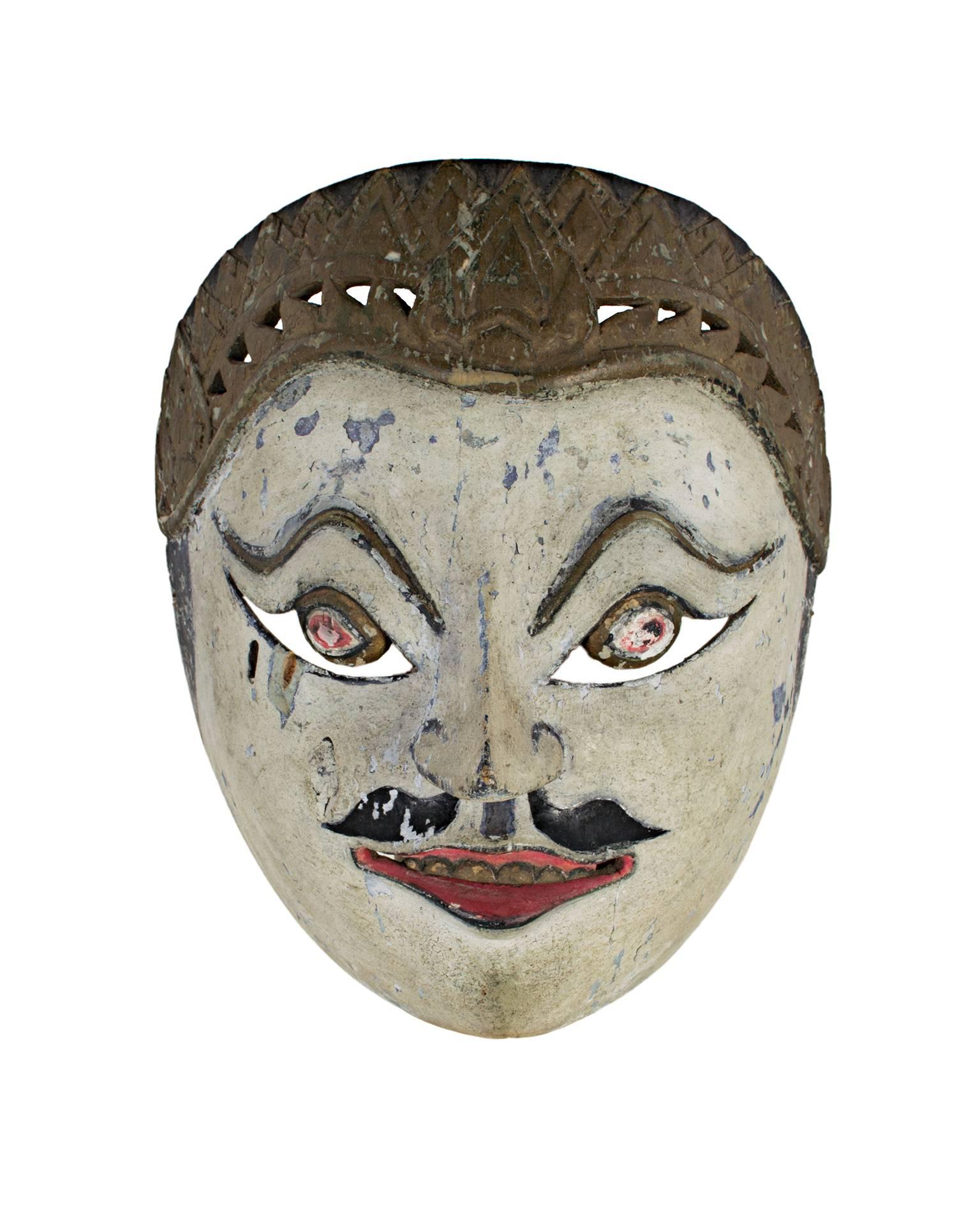 "Mask with White Face, Round Eyes, and Painted Mustache, " Wood from Indonesia - Sculpture by Unknown