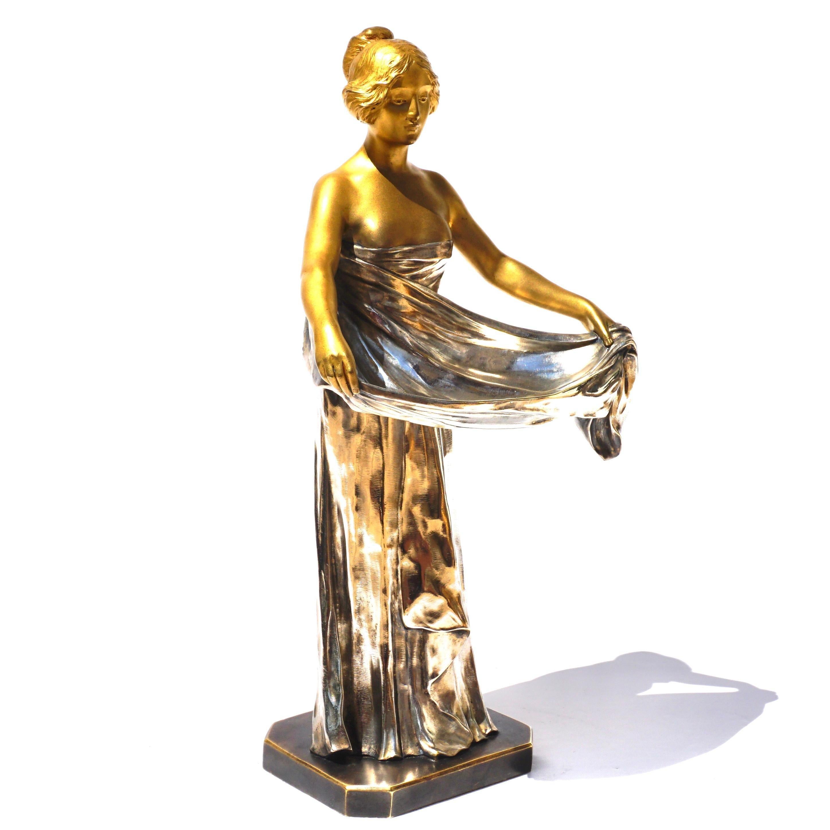 Maurice Bouval

French Art Nouveau Gilt and Silvered Bronze Figural Vide Poche
Cast from a model by Maurice Bouval, cast by Jollet & Cie., Paris, circa 1900
Modeled as a maiden in a standing pose lifting the upper end of her garment to form a wide