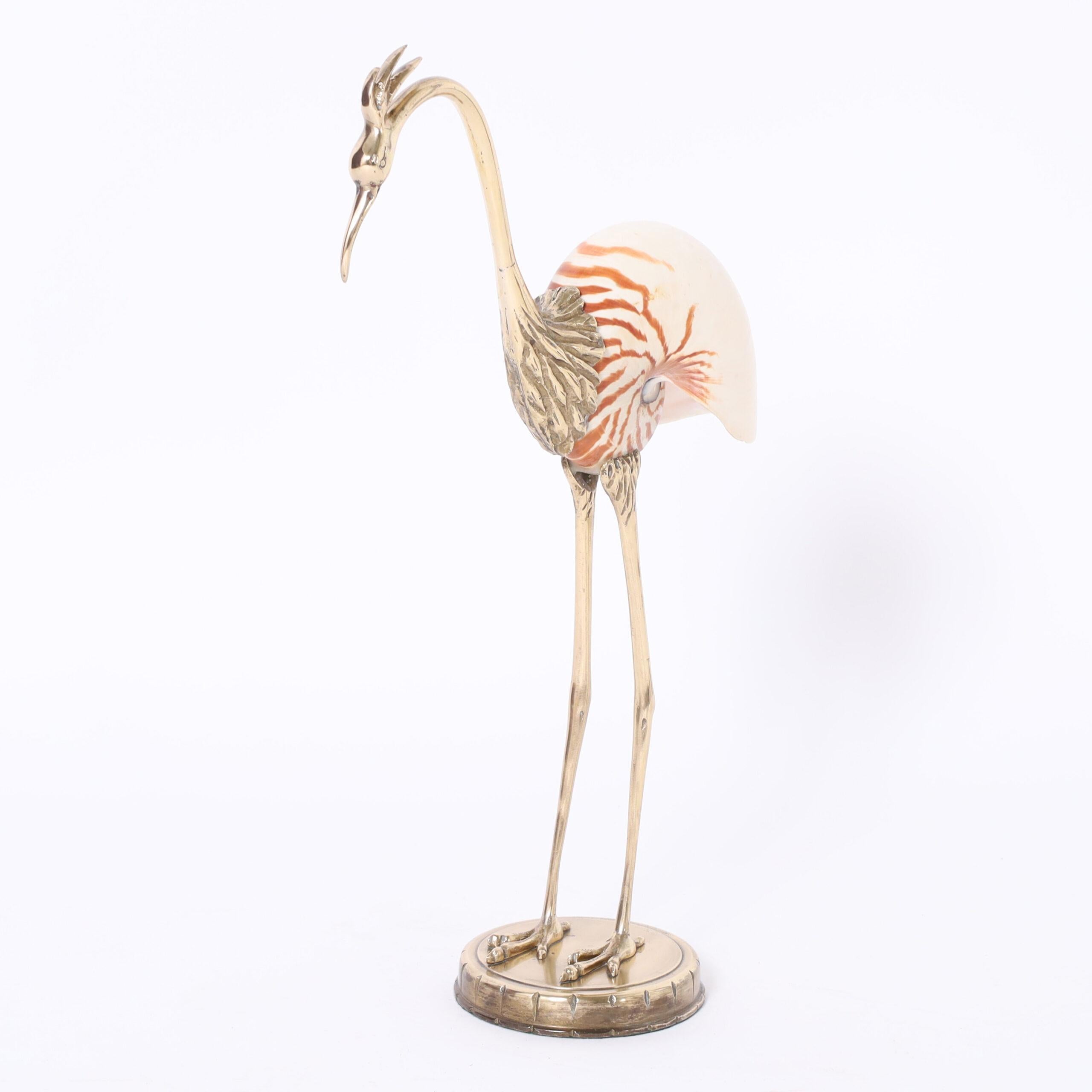 Vintage Italian Heron or Stork sculpture crafted in brass and featuring a nautilus shell body in the style of Binazzi.