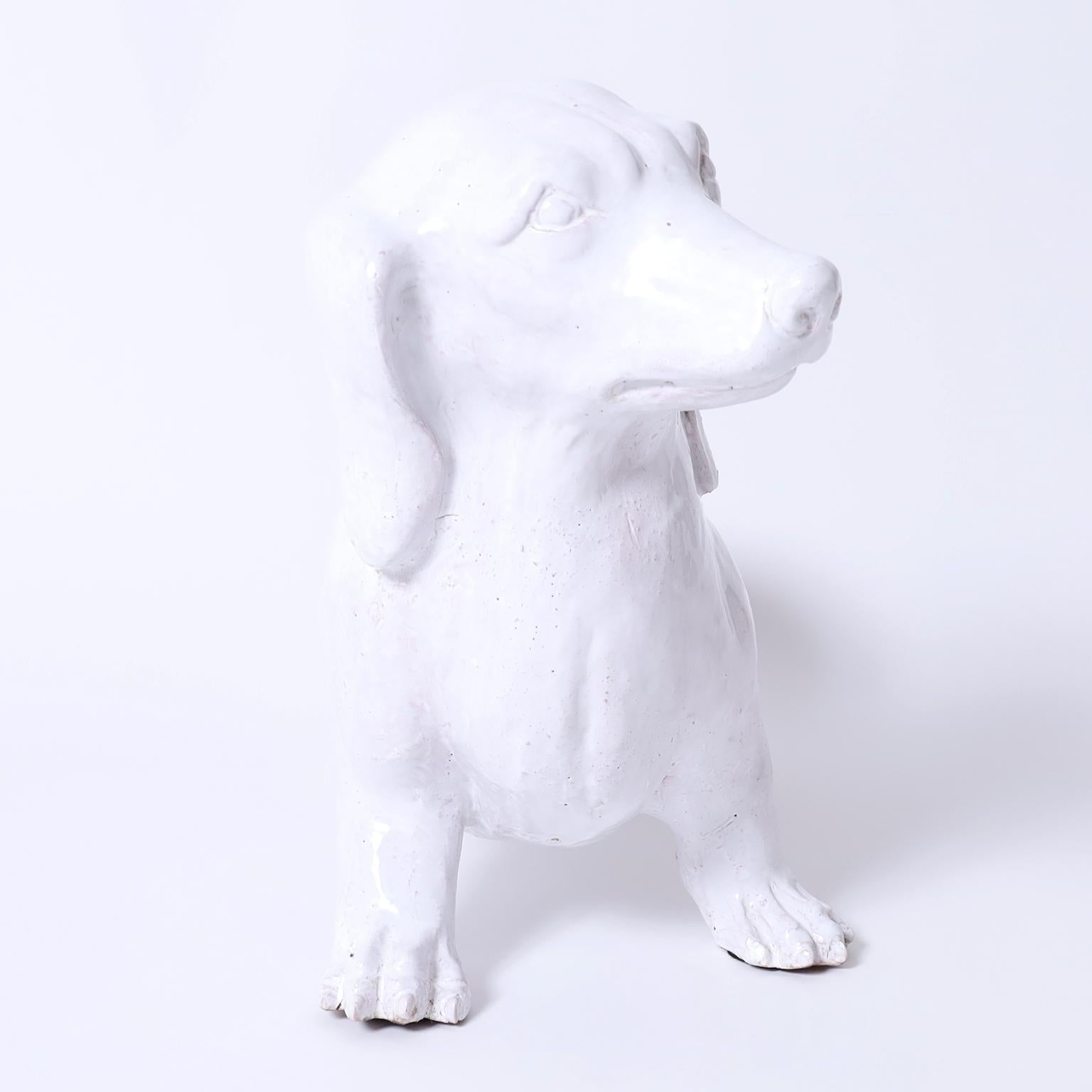 Italian terra cotta dachshund or doggy with a white glaze and realistic form ready to be rescued.