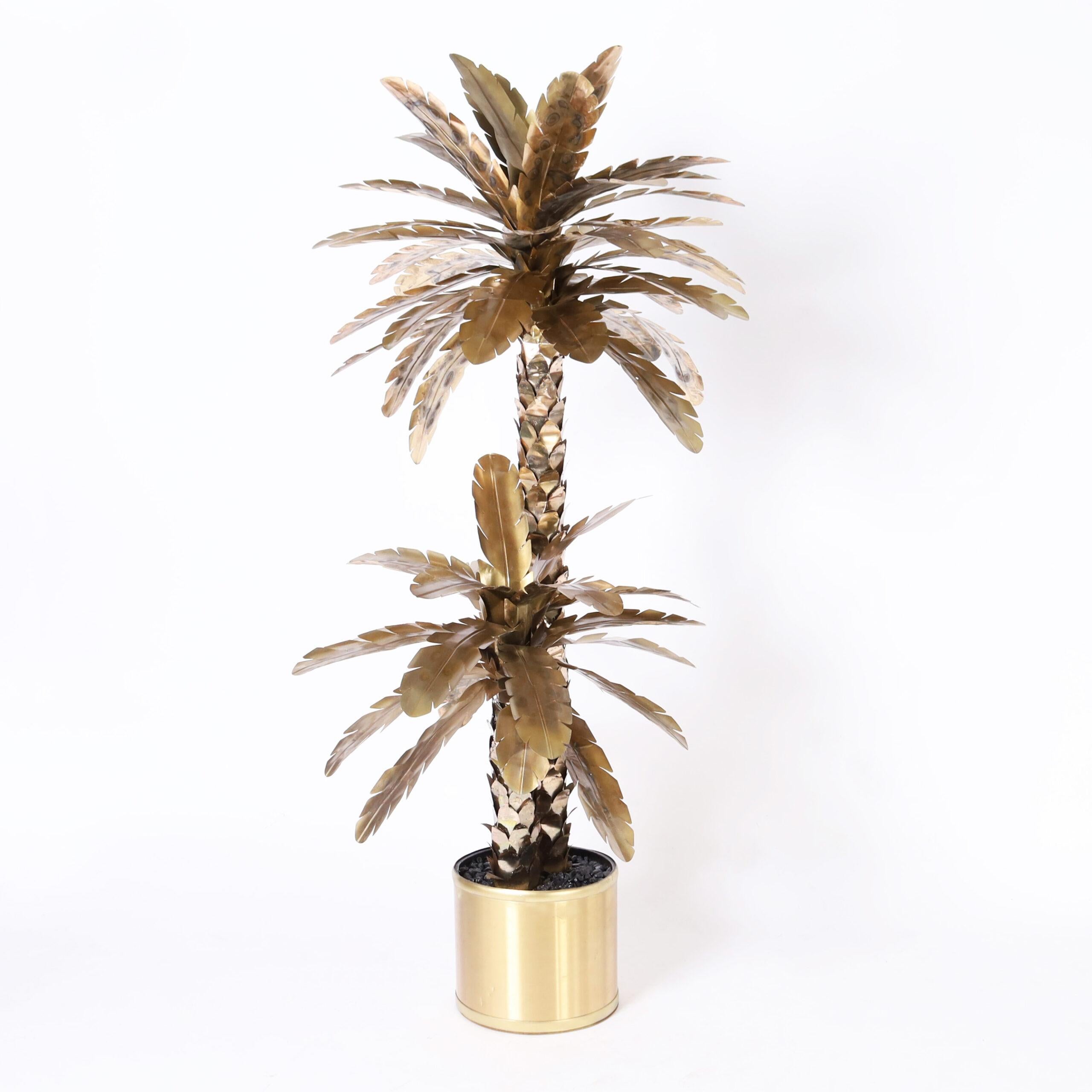 Chic Large scale vintage palmetto palm tree sculpture crafted in metal having a "hip" anodized finish with torch burnt highlights.