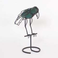 Scultura a forma di pappagallo in metallo della metà del secolo scorso