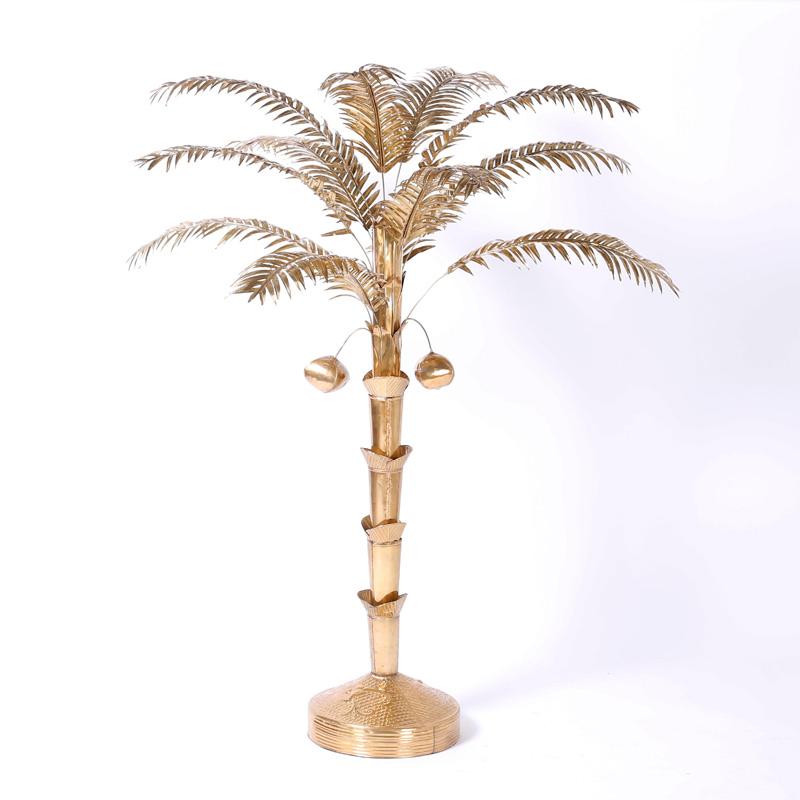 Chic midcentury stylized palm tree with removable fronds, coconuts, reticulated trunk and a round weighted base. Hand polished and lacquered for easy care.