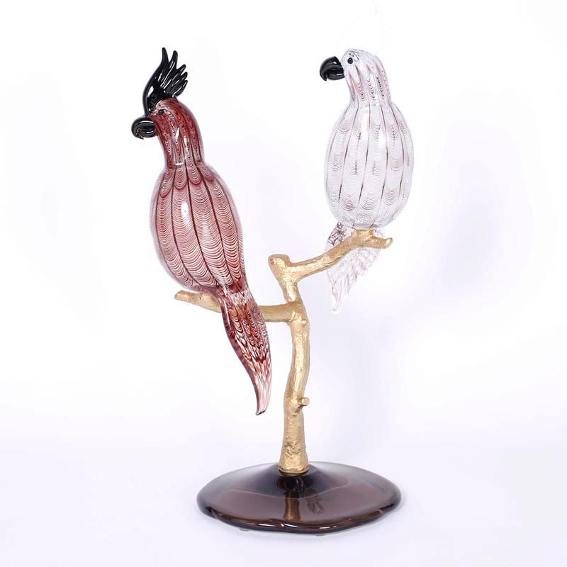 Midcentury sculpture depicting two hand blown cockatoos perched on a doré bronze tree on a glass base signed Zanetti.