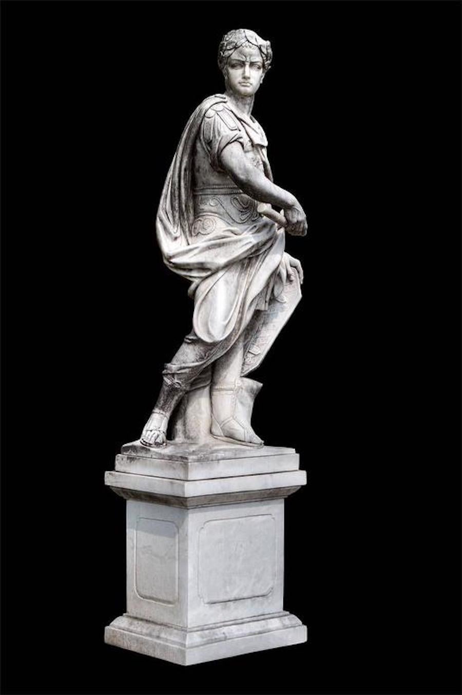 Standing figure of Julius Caesar wearing a Tunic and holding a billowing drapery with a composition marble square-section pedestal.
. The other figure is of Hannibal.
 Provenance from a Nord- Italian estate. 
Base:
H 85 cm, lxp=80x65 cm
 Sculpture
