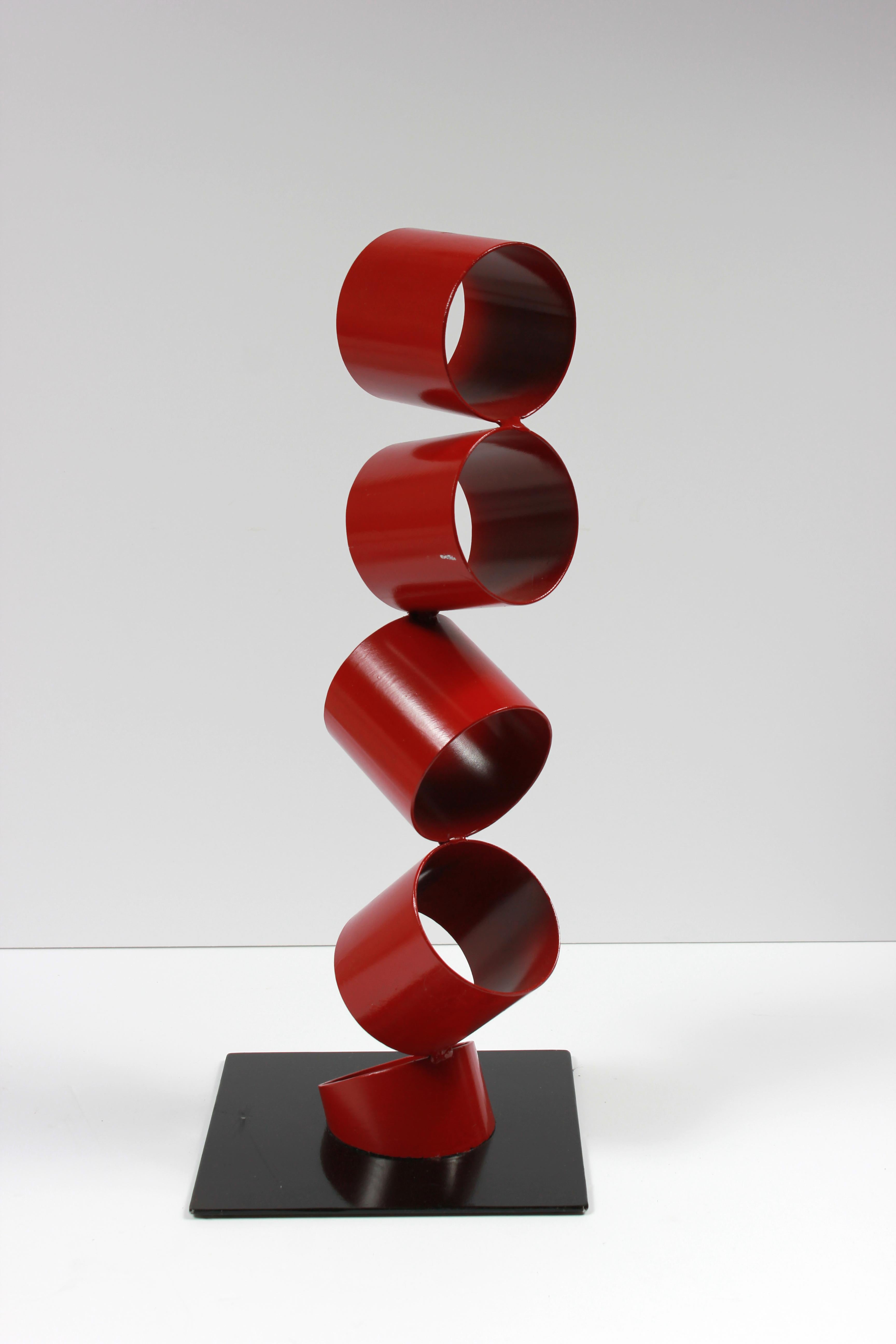 Multimedia Metal Sculpture of Six Red Rings in an Angled Stack 1
