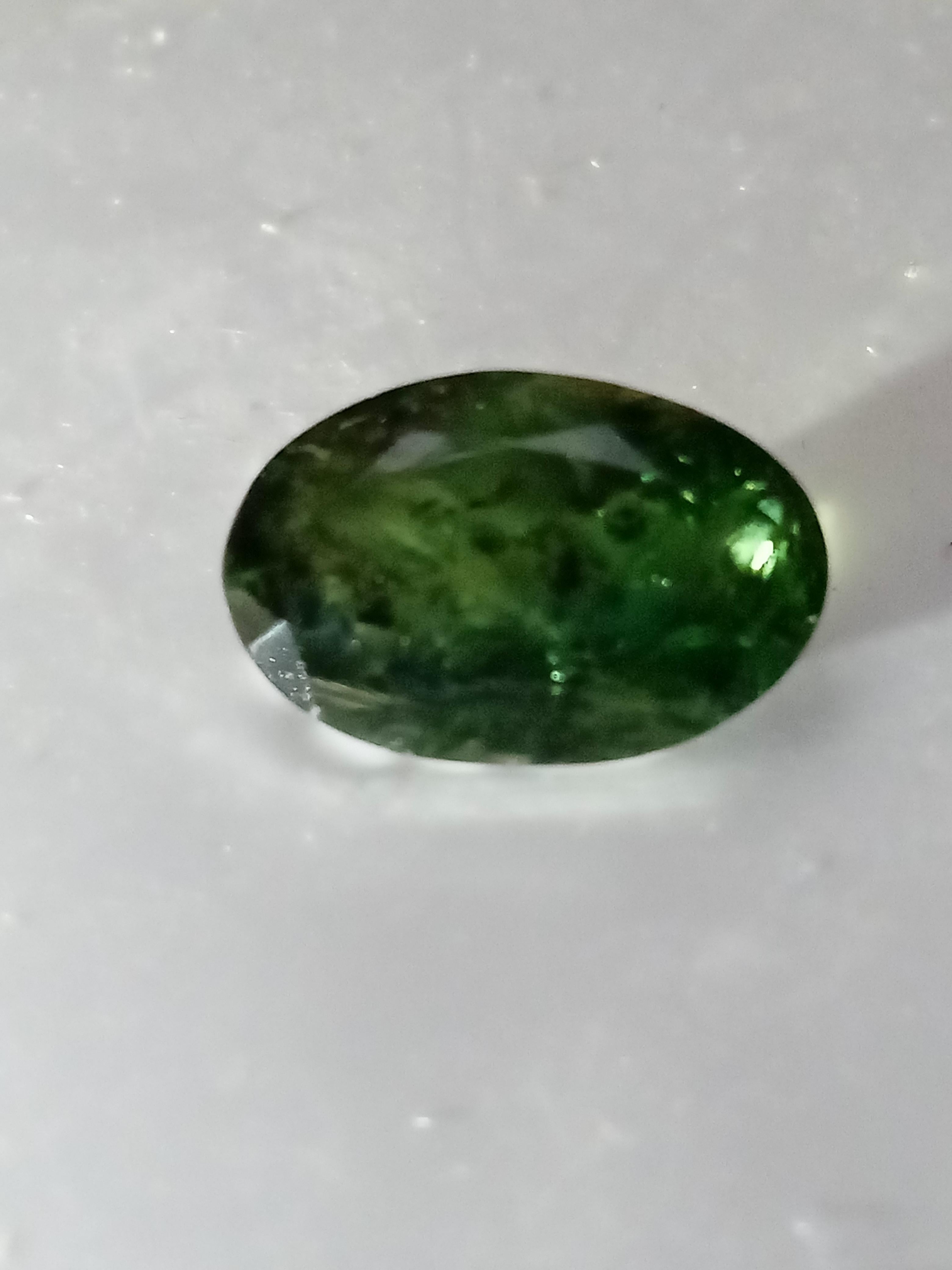 Natural green Australia sapphire not heated not treated with slight natural inclusions weight 5.35 carat
Add a touch of elegance to your jewellery collection with this stunning 5.3-carat oval-cut natural green sapphire from Australia. It has a very