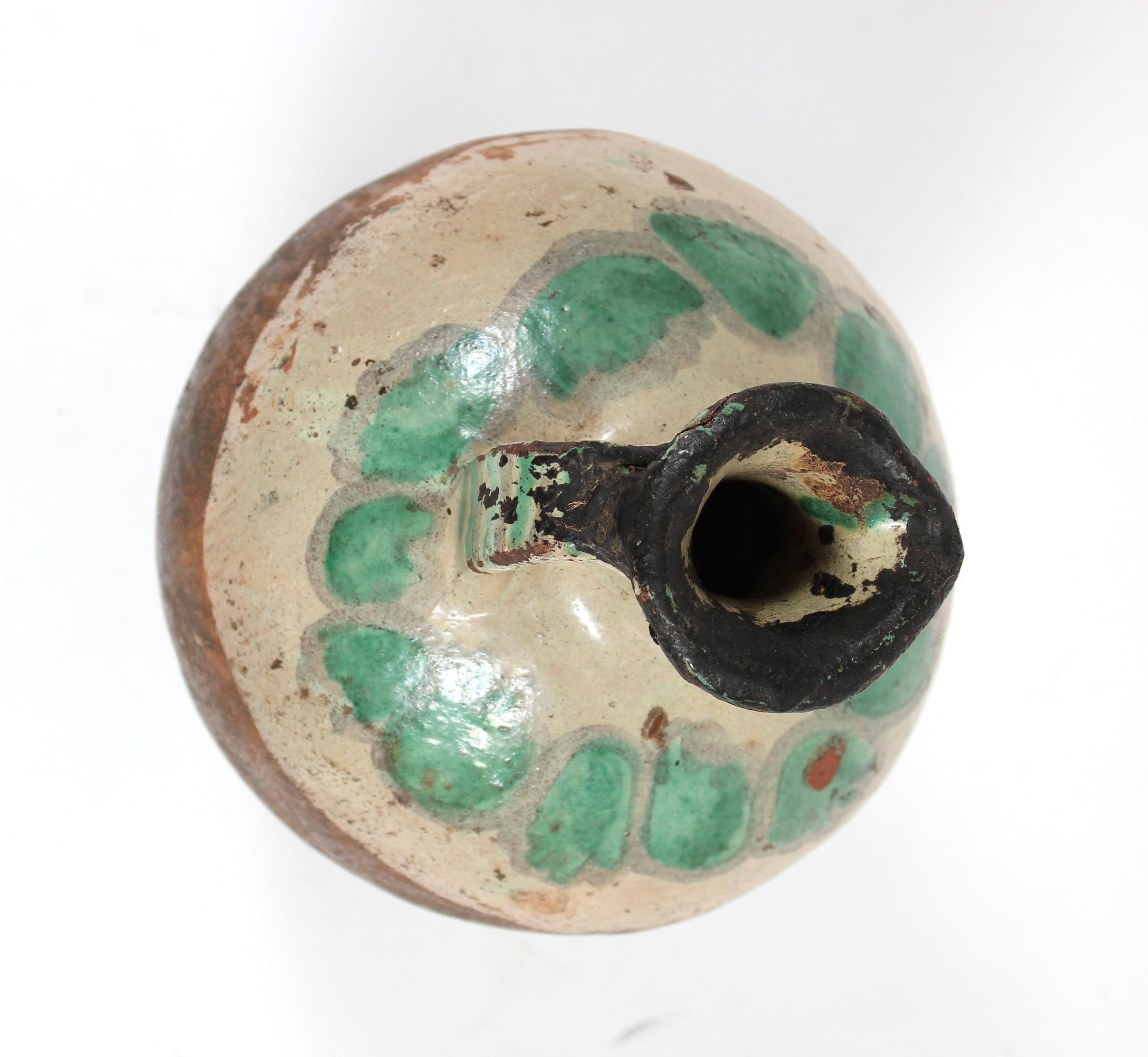 This mid - late 20th century organic ceramic vase with taupe, turquoise and red is by an unknown artist.