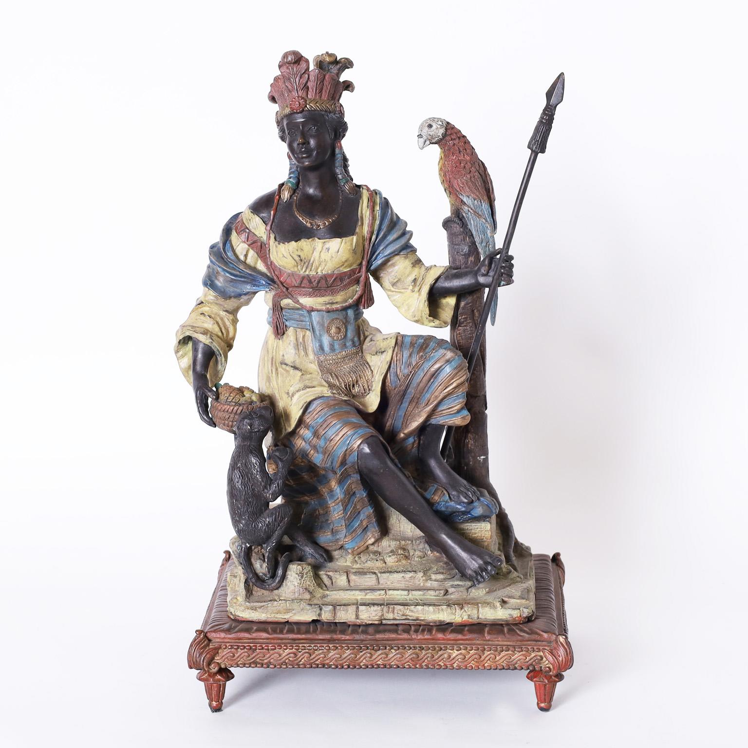 Antique orientalist bronze with an impressive composition depicting a female warrior with a spear, a parrot on a tree stump, and a monkey with a fruit bowl all with the original cold painted finish.