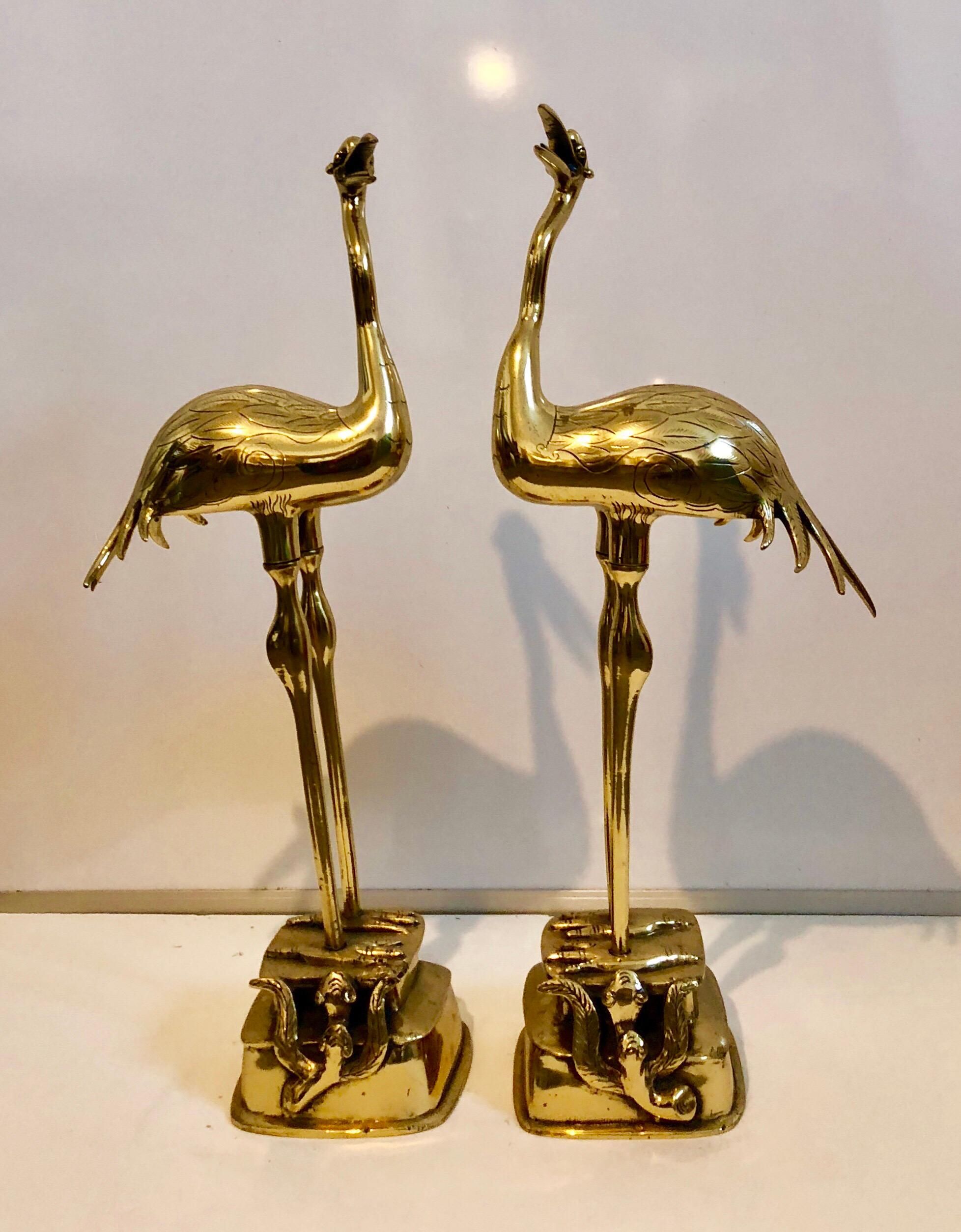 Pair of 19th century decorative polished bronze (or brass) Japanese (or Chinese, these are definitely Asian) sculptural cranes (or flamingos) resting on a rock with snakes. Animalia candle holders. missing the pricket piece that holds the candle. 
