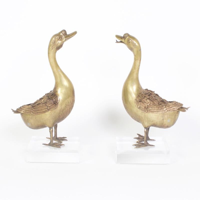 Important pair of Japanese bronze birds in the form of geese masterfully crafted. One with a closed beak the other open, both with quirky expressions. These antique bronze figures have a rare attention to detail and for the pair to be together after