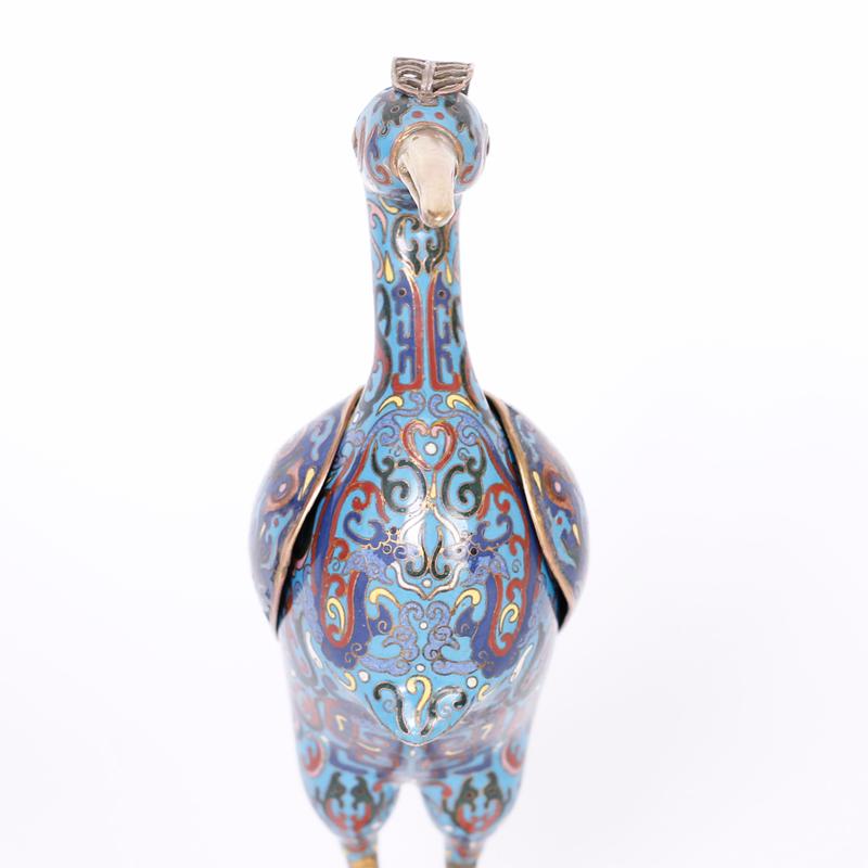 Pair of life size Chinese cloisonné or enamel on copper birds decorated with elaborate floral designs, having brass crests, beaks, and feet and removable wings.