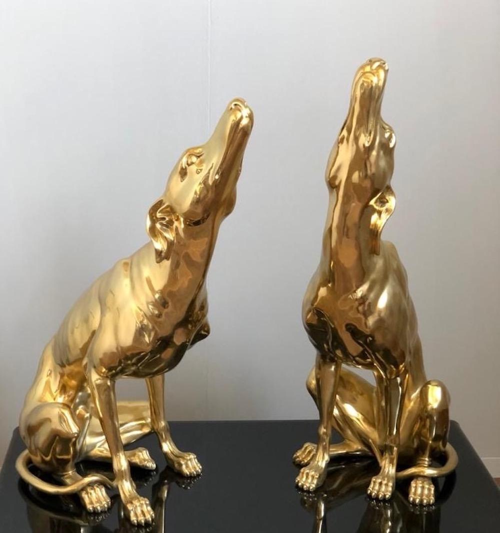 Fine pair of gilt bronze dog sculptures. The item will be well-suited to either an indoor or outdoor setting.