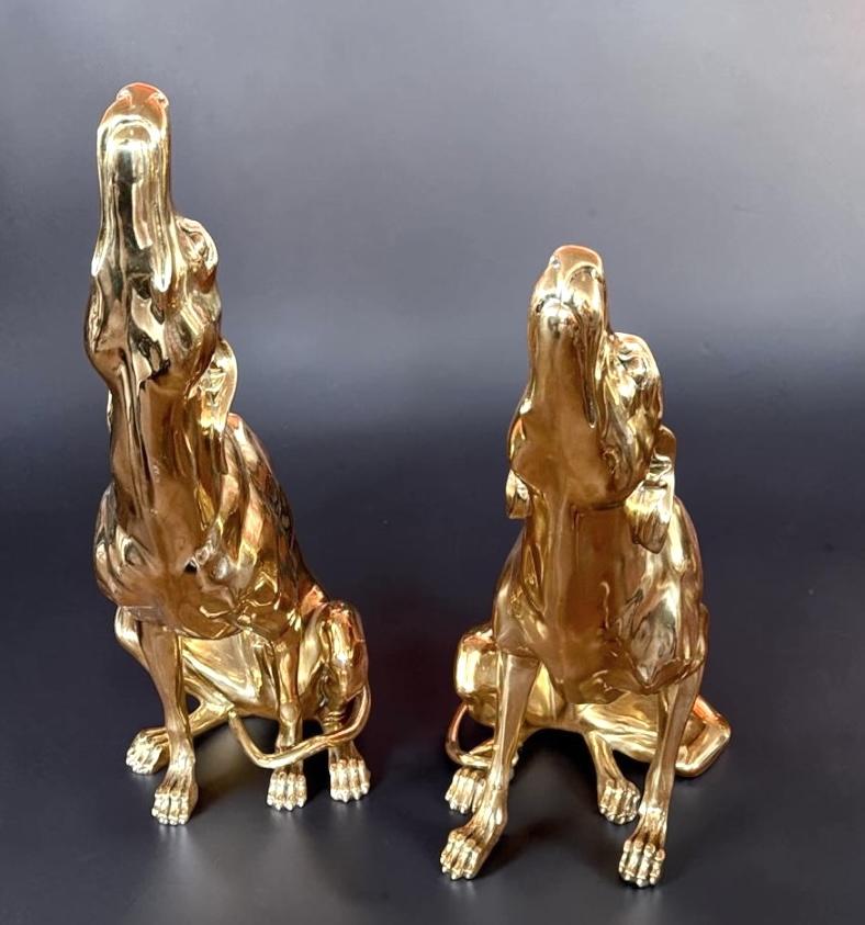 Fine pair of gilt bronze dog sculptures. The item will be well-suited to either an indoor or outdoor setting.