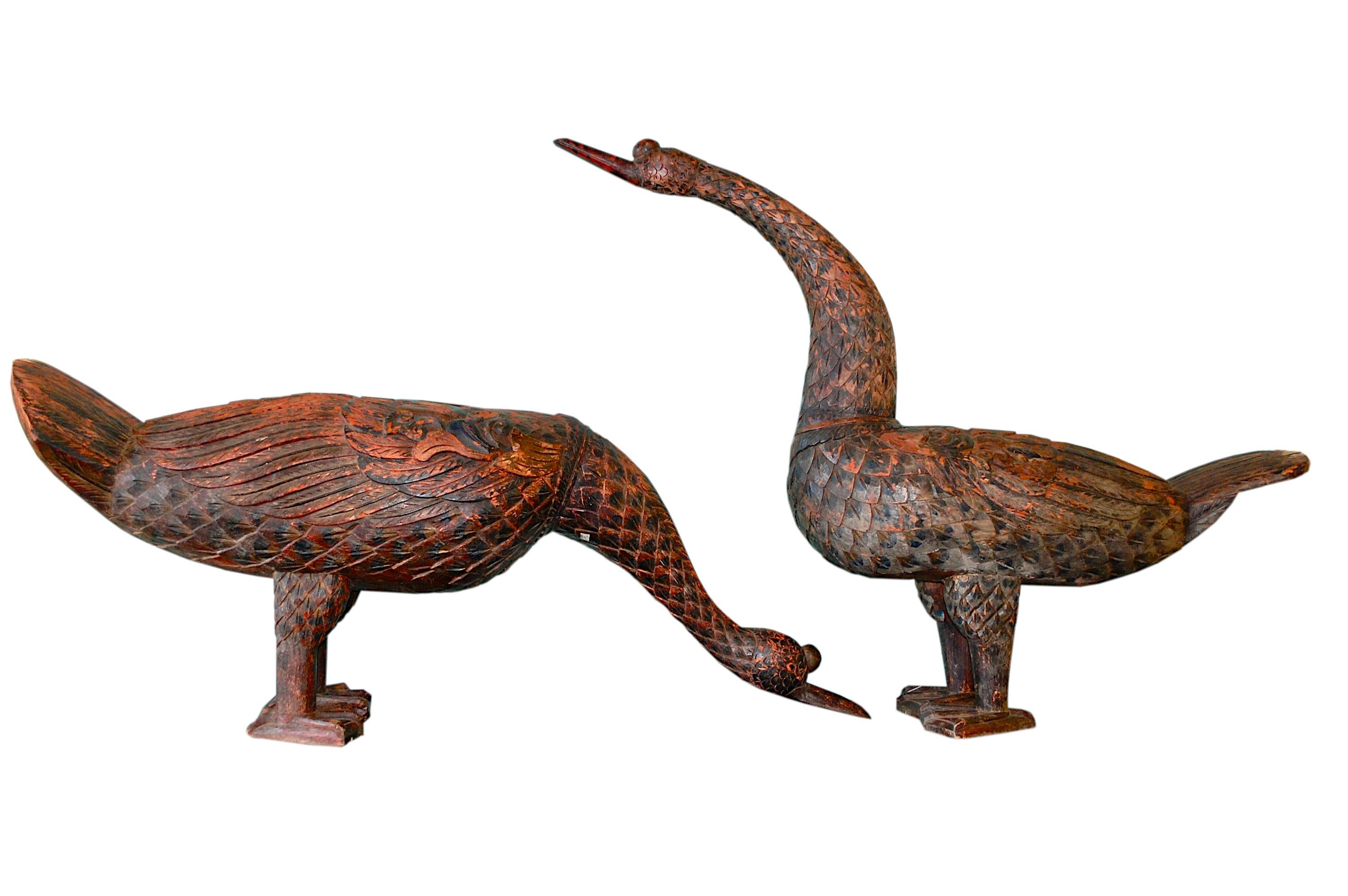 Pair of large Chinese wood geese.
Rare early 20th Century hand carved exotic wood and polychrome, heavy geese sculptures with beautiful earthy colors. Some small natural old wood cracks and paint loss as shown on photos, overall very good condition.