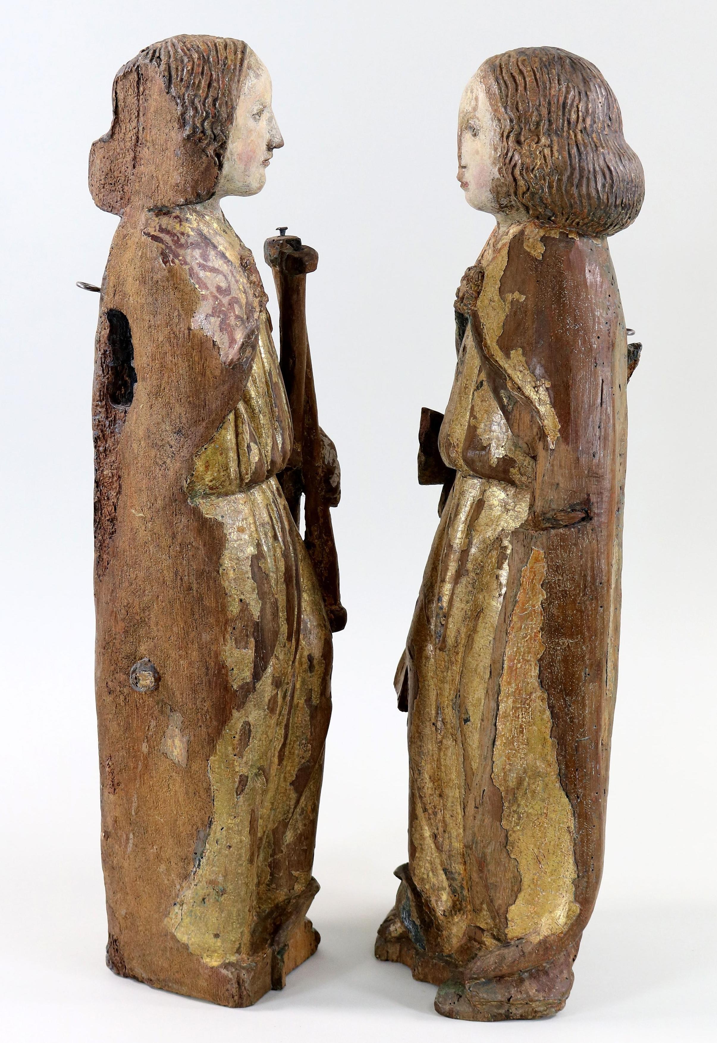 Pair of gilt and polychrome wood angels around 1500

These angels belonged to a gallery of angels carrying the instruments of the Passion, of which only one of our angels preserves the attributes.

Important remains of the original gilding, enhanced