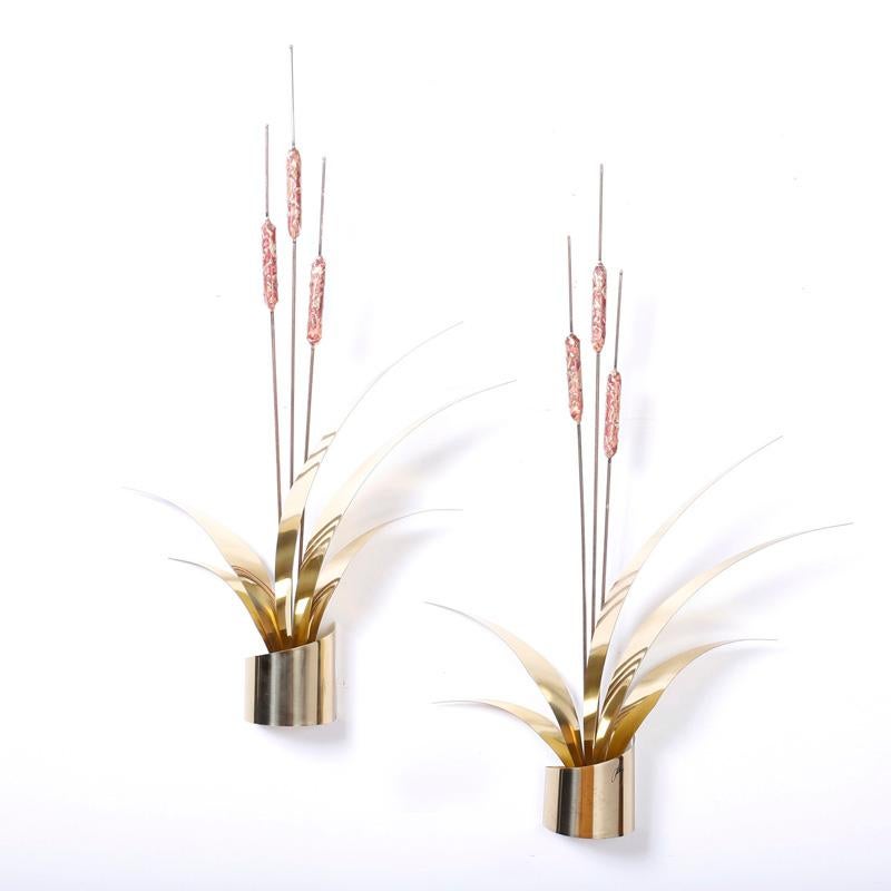 Swank pair of wall sculptures crafted in copper and brass in the form of stylized cattails or Typha. Hand polished and lacquered for easy care.
