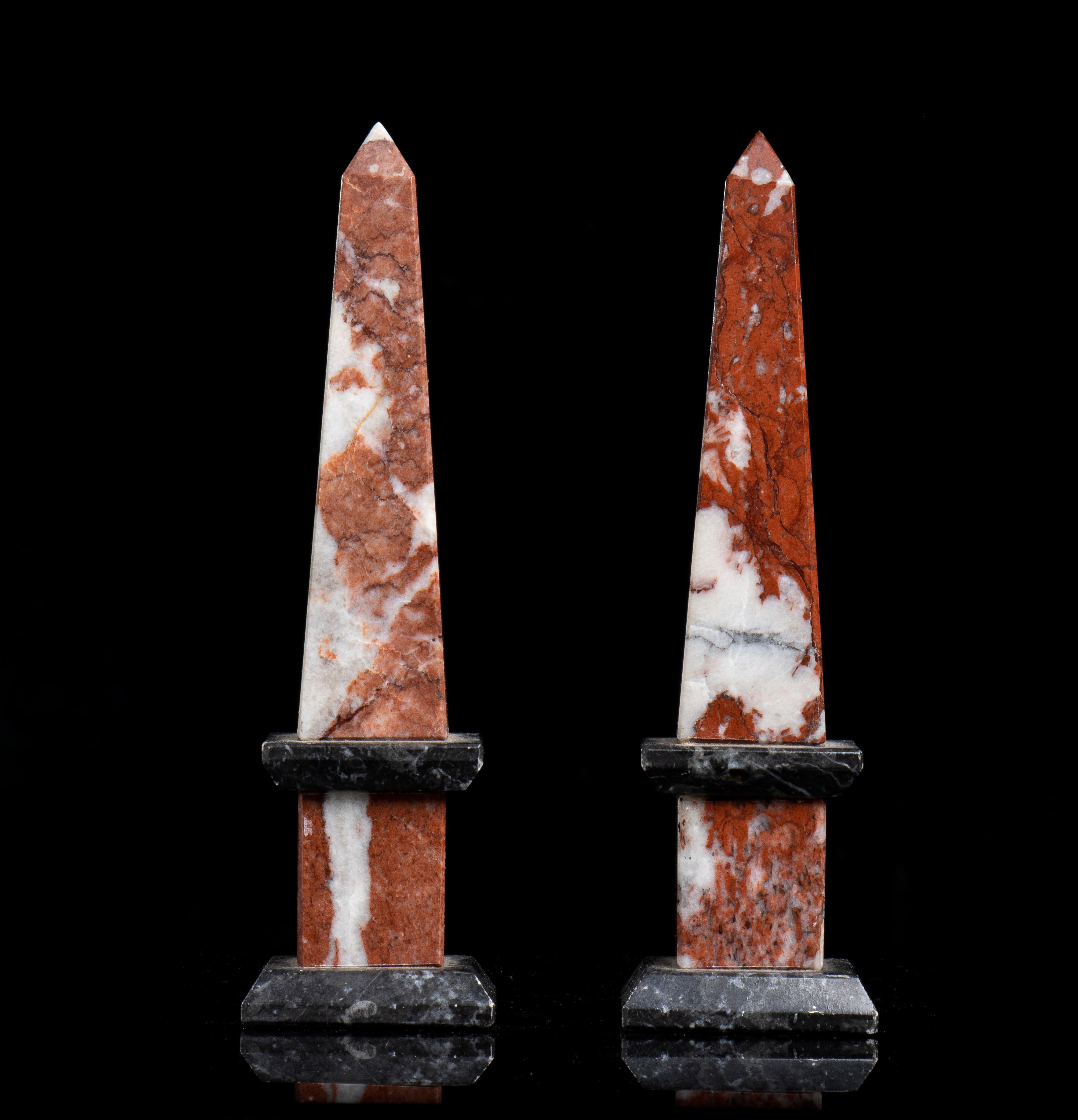 a very interesting and beautiful pair of obelisks carved in a warm and precious red marble the Red France Languedoc Incarnat, used for important and uinque decoration in the Versailles Palace and more notable sites; the obelisks framed with two