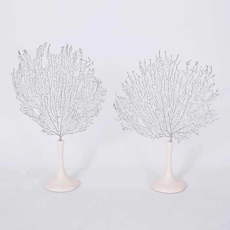 Pair of sea fan sculptures crafted or dipped in silvered metal with amazing accuracy and presented on classic form lacquered stands. Signed Eduardo Garza 2008 on the bottoms.

Measures: 
H: 19 W: 14 D: 5
H: 20 W: 13 D: 5