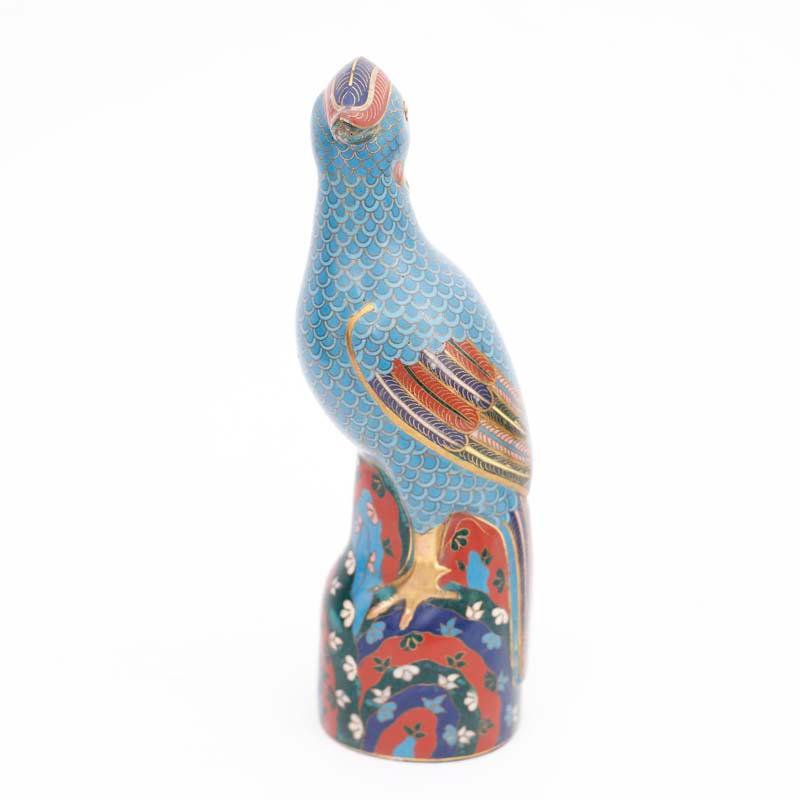Intriguing pair of vintage Chinese cloisonne or enamel on brass birds with quizzical expressions, colorful wings and tails, blue bodies and floral bases.