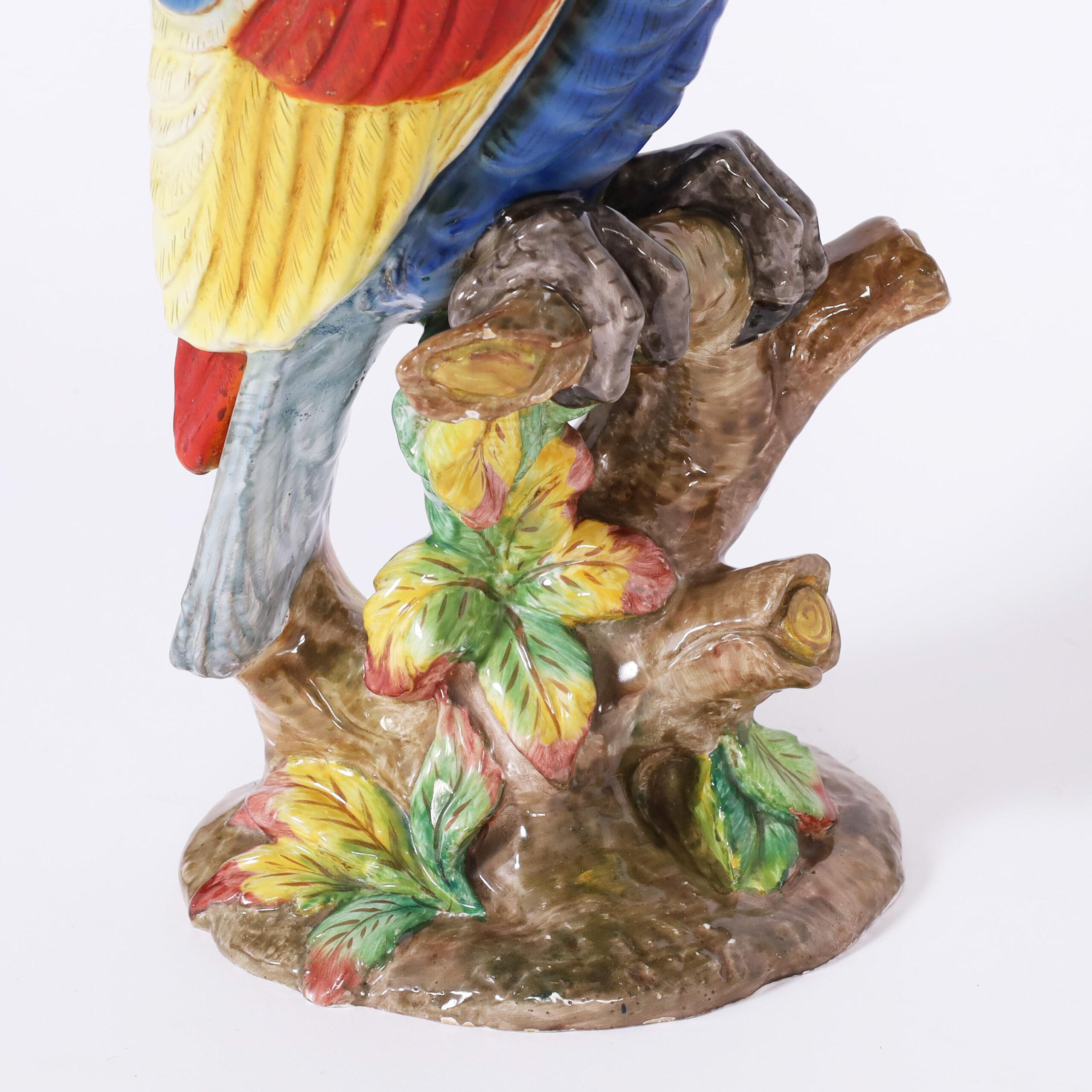 Striking pair of life size porcelain parrots perched on tree trunks, hand decorated with vivid tropical colors and signed Zaccognini on the bottom.

Left: H: 21.5 W: 8 D: 6
Right: H: 22.5 W: 9 D: 6