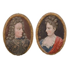 Pair of Wooden Plaques Depicting a Man and Woman, Carved ca. 1700's