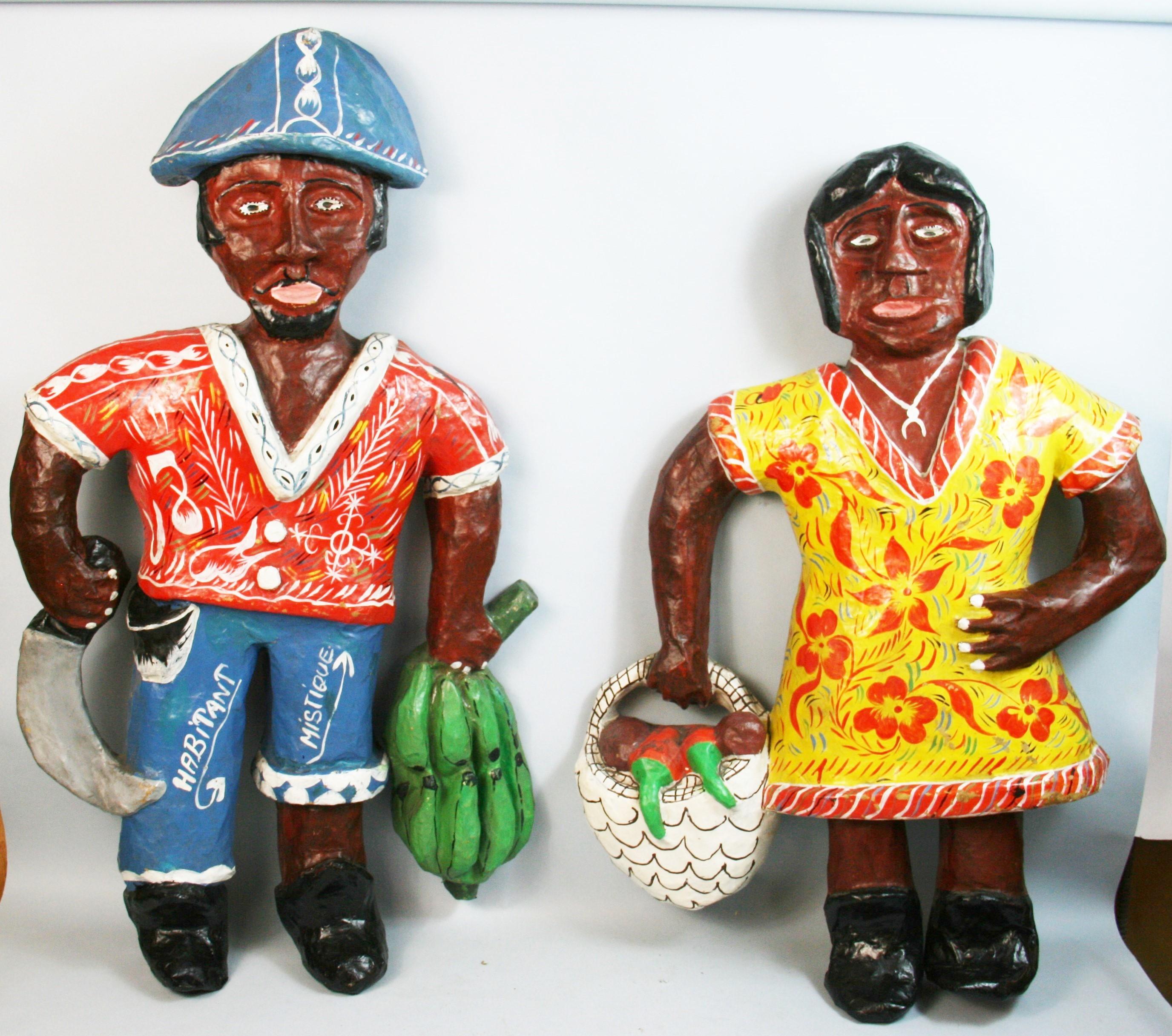 1482 Pair oversized primitive hand made and painted Caribbean figural wall sculptures made from corrugated boxes and hand painted