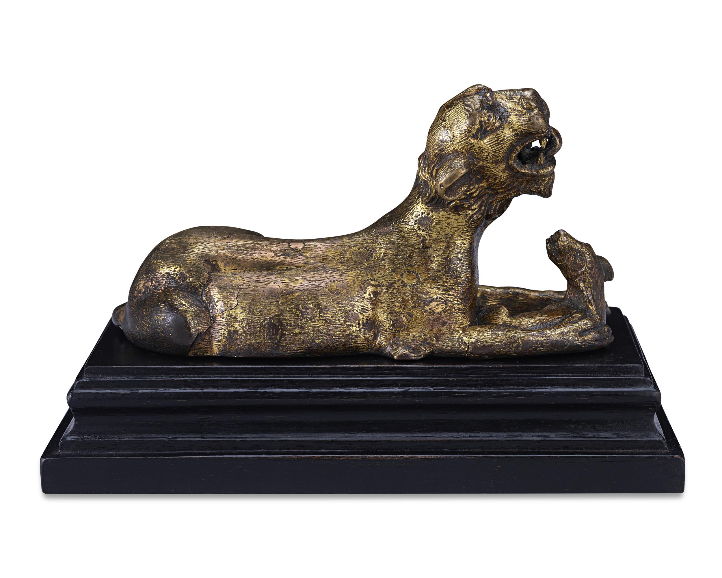 This 17th-century bronze sculpture, likely hailing from southern Germany, depicts a scene of life-and-death struggle in nature — a hapless hare caught in the claws of a mighty panther. The artist who modeled this richly patined bronze was clearly a