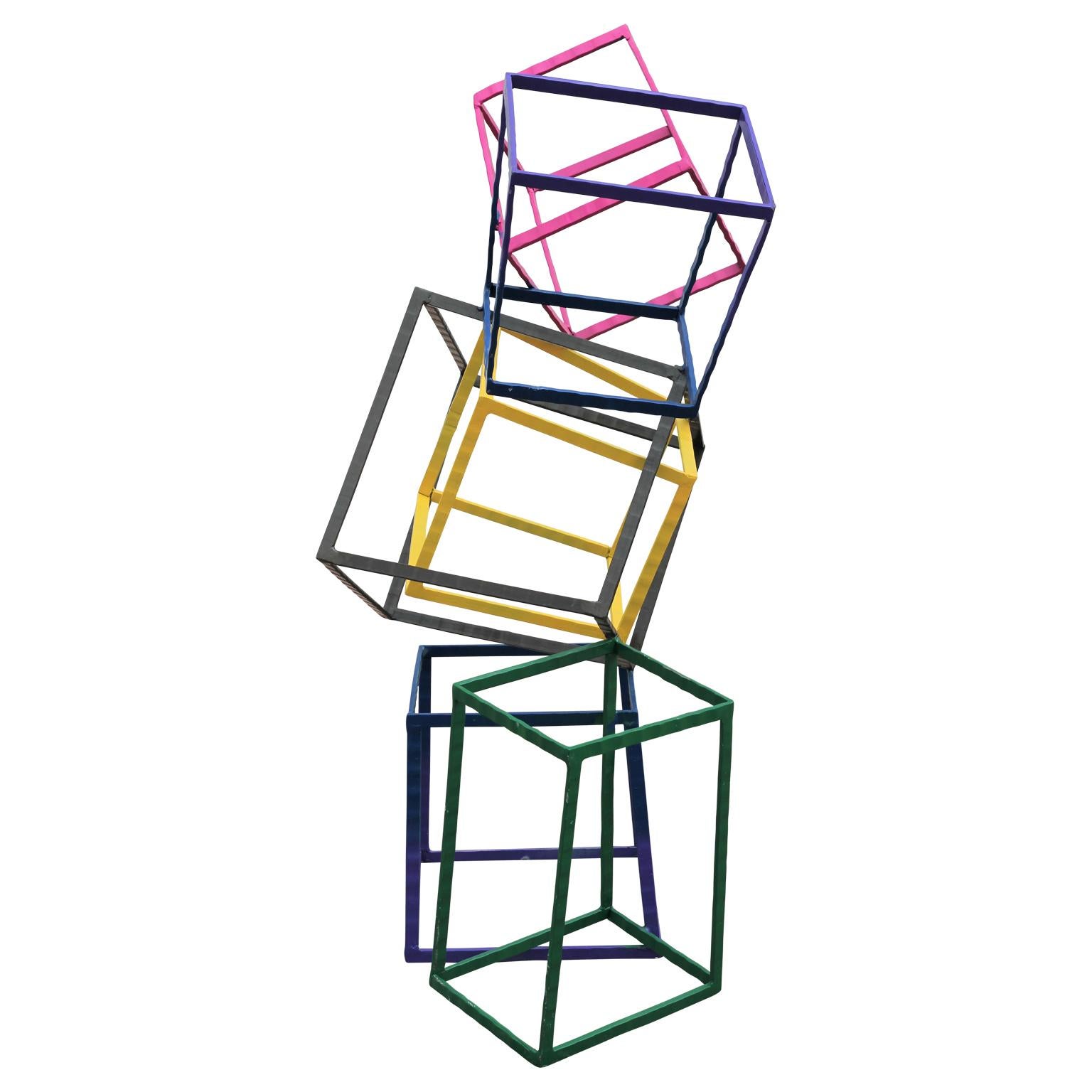 Colorful geometric sculpture that includes a variety of square boxes stacked on top of one another. The unique sculpture consists of welded metal that has been painted in a number of bright color that evokes Post Modern design.