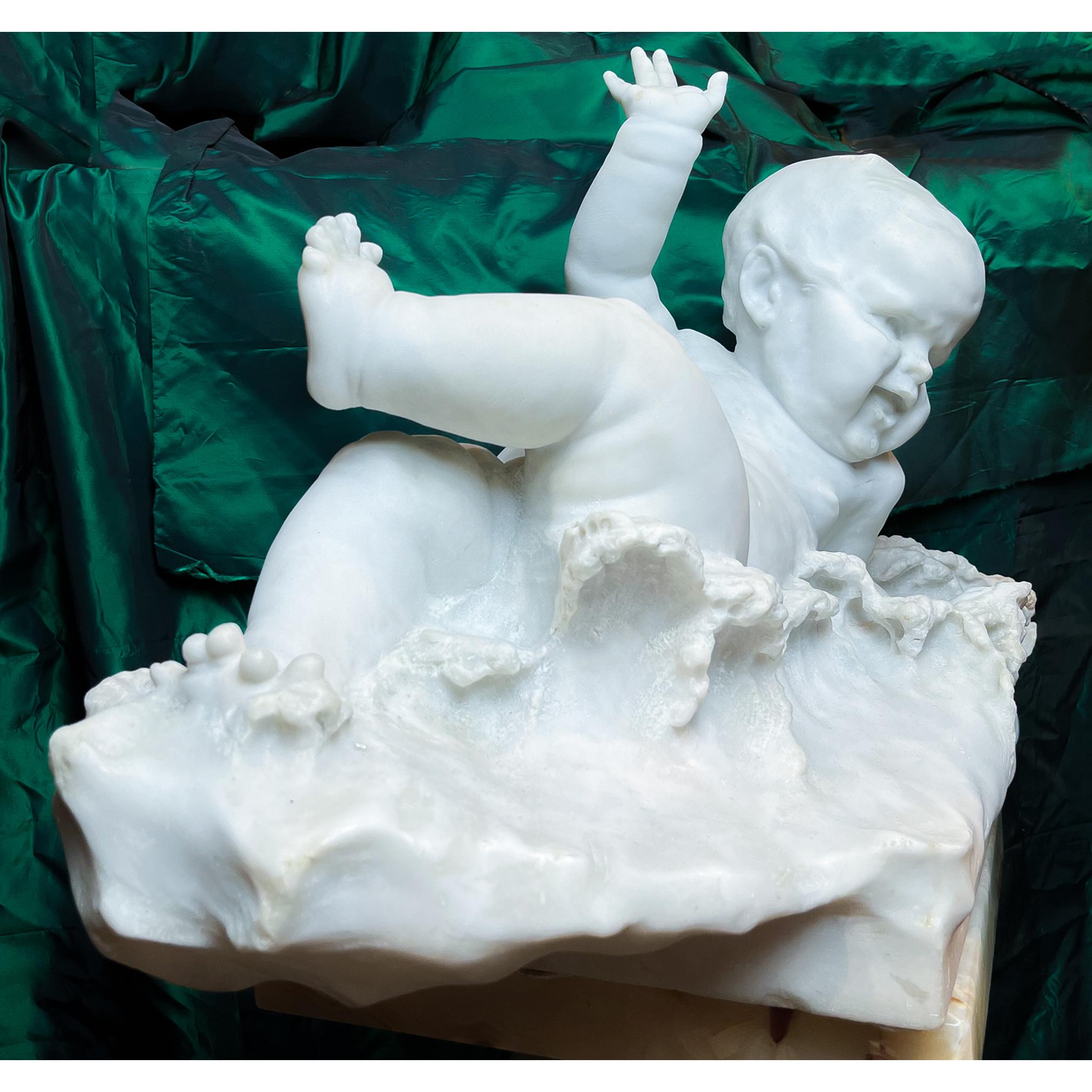 The child's dynamic pose is gleeful, as he sways his endearingly chubby arms and legs amongst the water's foamy waves. Primo Bagno or First Bath is carved into the front of the incorporated rectangular base. 

Signed by artist on the base; Felice