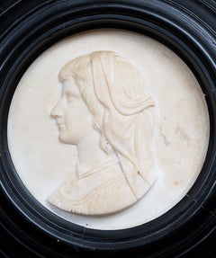 Antique white marble statuary profile with ebonized wood frame.