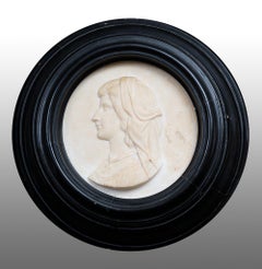 Antique white marble statuary profile with ebonized wood frame.