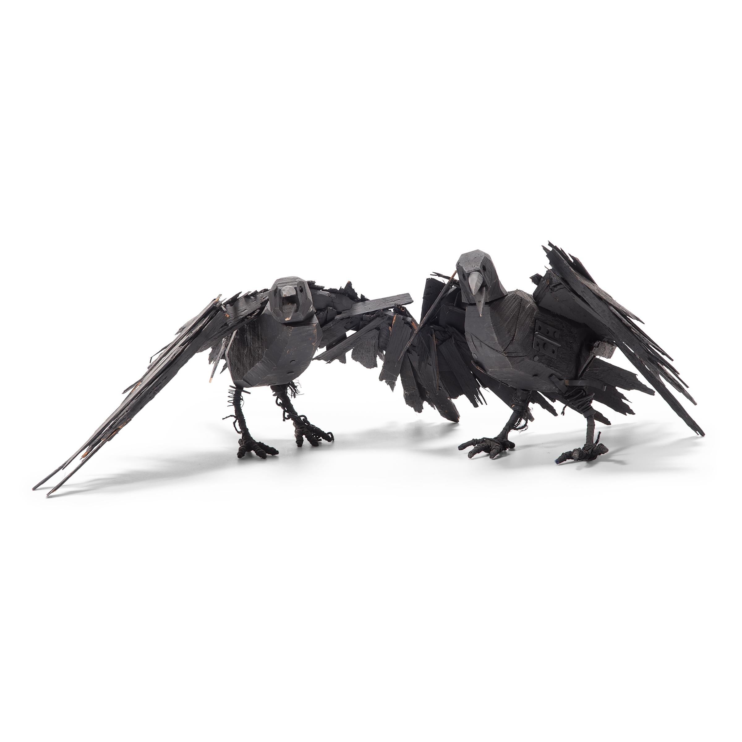 Richly textured with whimsical appeal, this late 20th century wooden crow is a delightful example of naive American sculpture. Poised mid-caw, the crow's wings are outstretched, ready to burst into flight. As though life materialized from a pile of