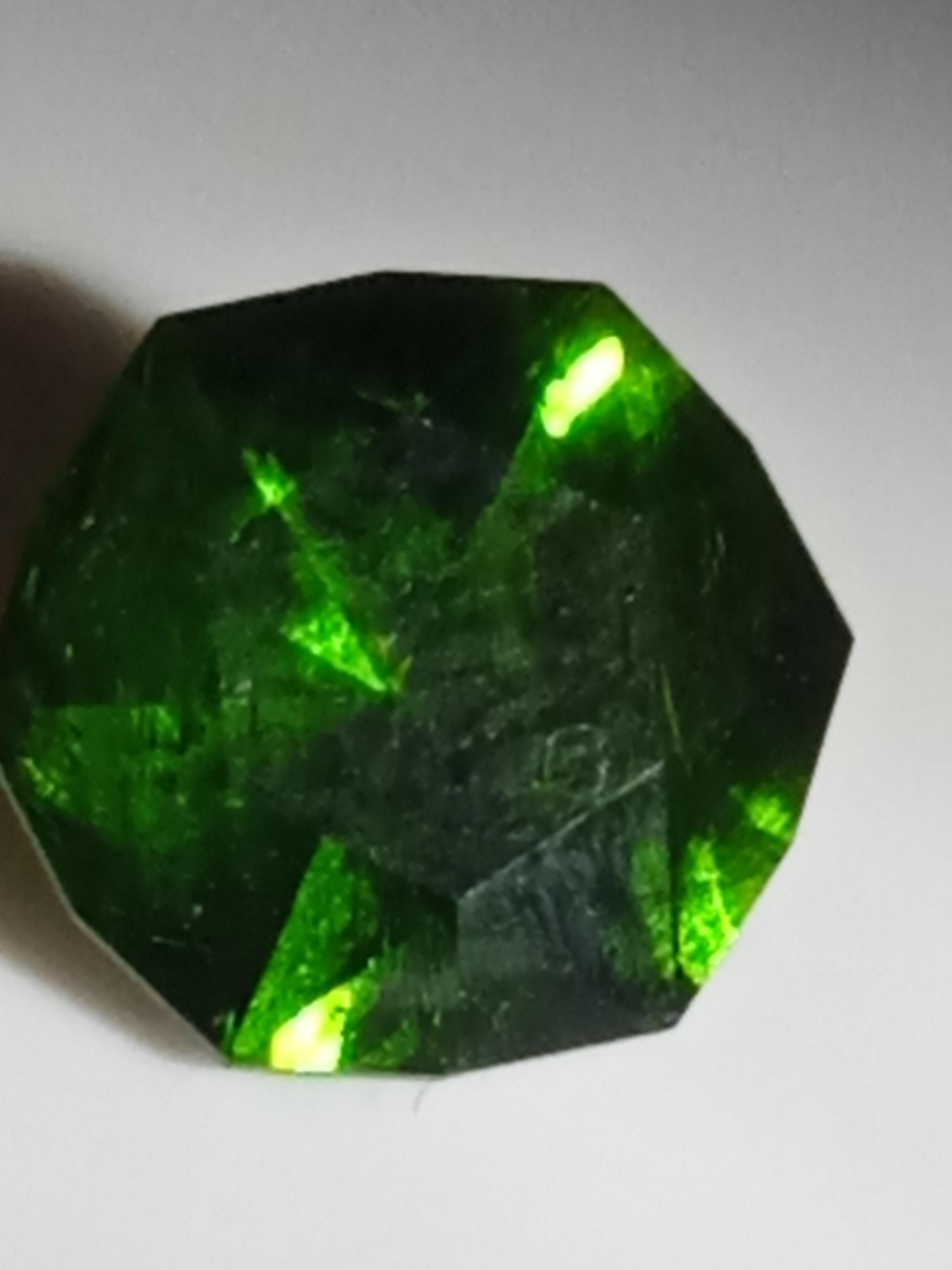 This rare and natural Diamantoid Garnet is a unique piece of gemstone. The gemstone boasts a beautiful green colour with a brilliant cut shape. It is transparent and has a slight inclusion clarity grade. The gemstone is from the Ukraine region and