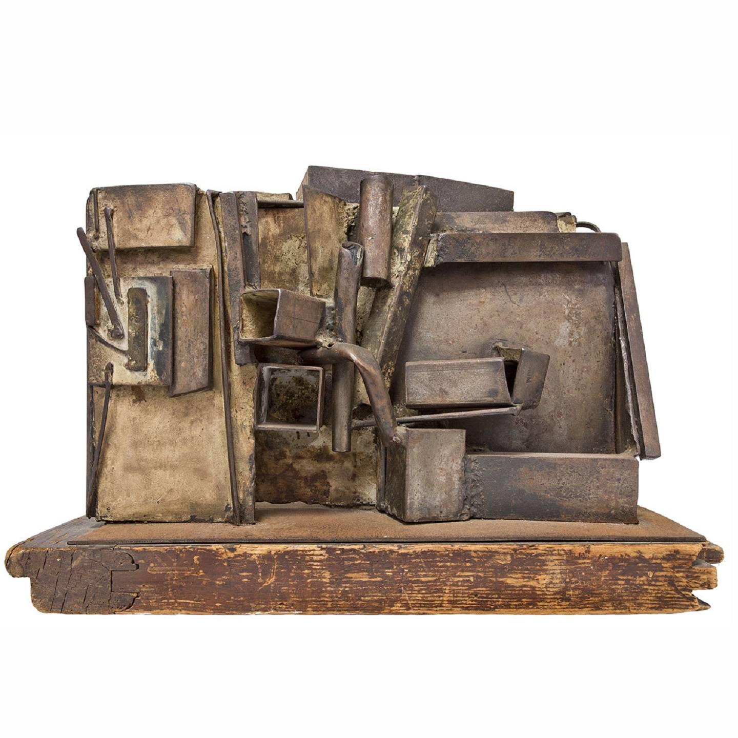  Large Abstract Expressionist Welded Assemblage Sculpture. it appears unsigned. it is on a found wood original base. it has a Brutalist quality to it. It commands a lot of presence