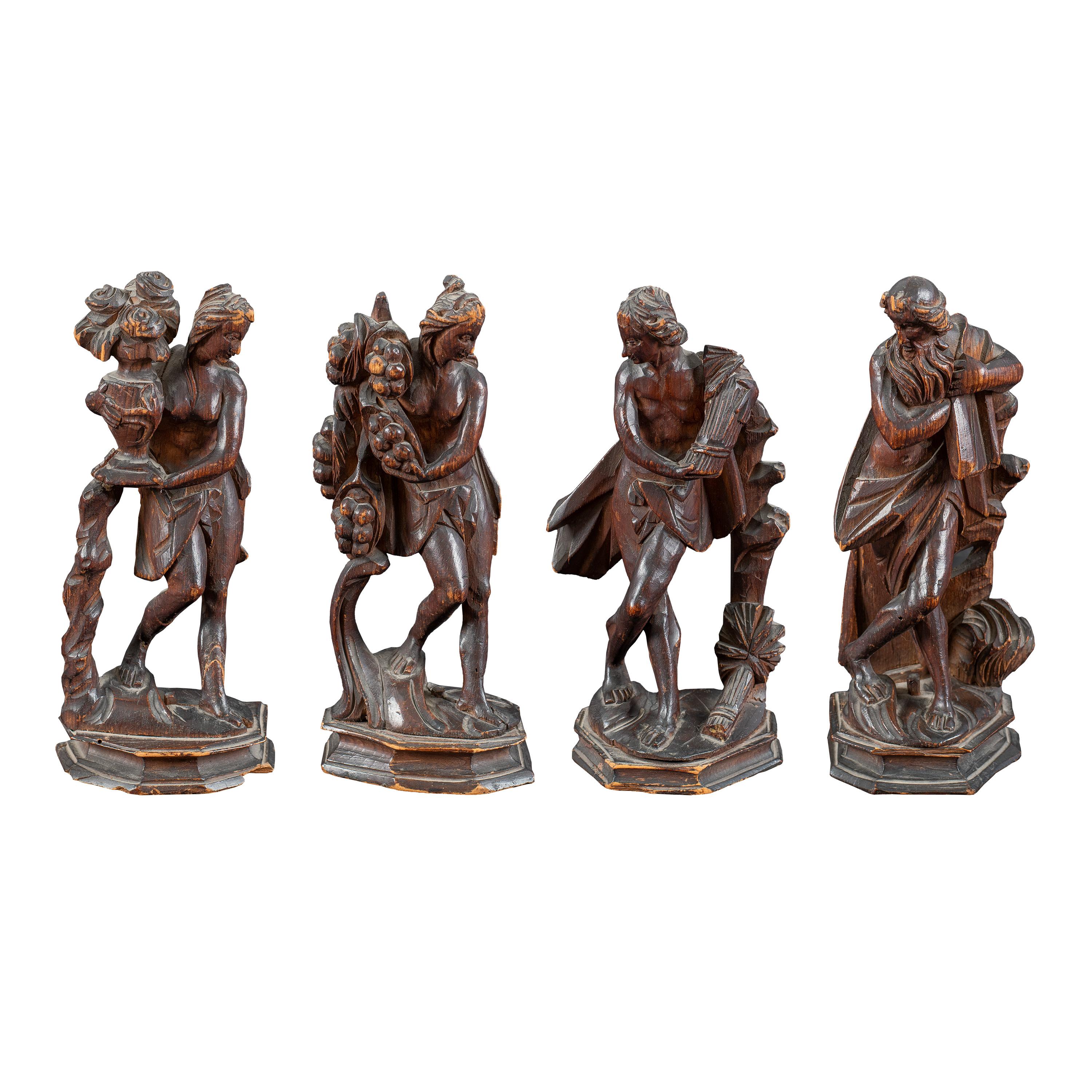 Unknown Figurative Sculpture - Rococò Venice - Set of four 18th century carved wood sculptures - Seasons