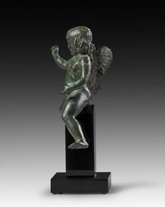 ANCIENT ROMAN BRONZE FIGURE OF WINGED EROS RIDING A DOLPHIN, 2ND CENTURY AD