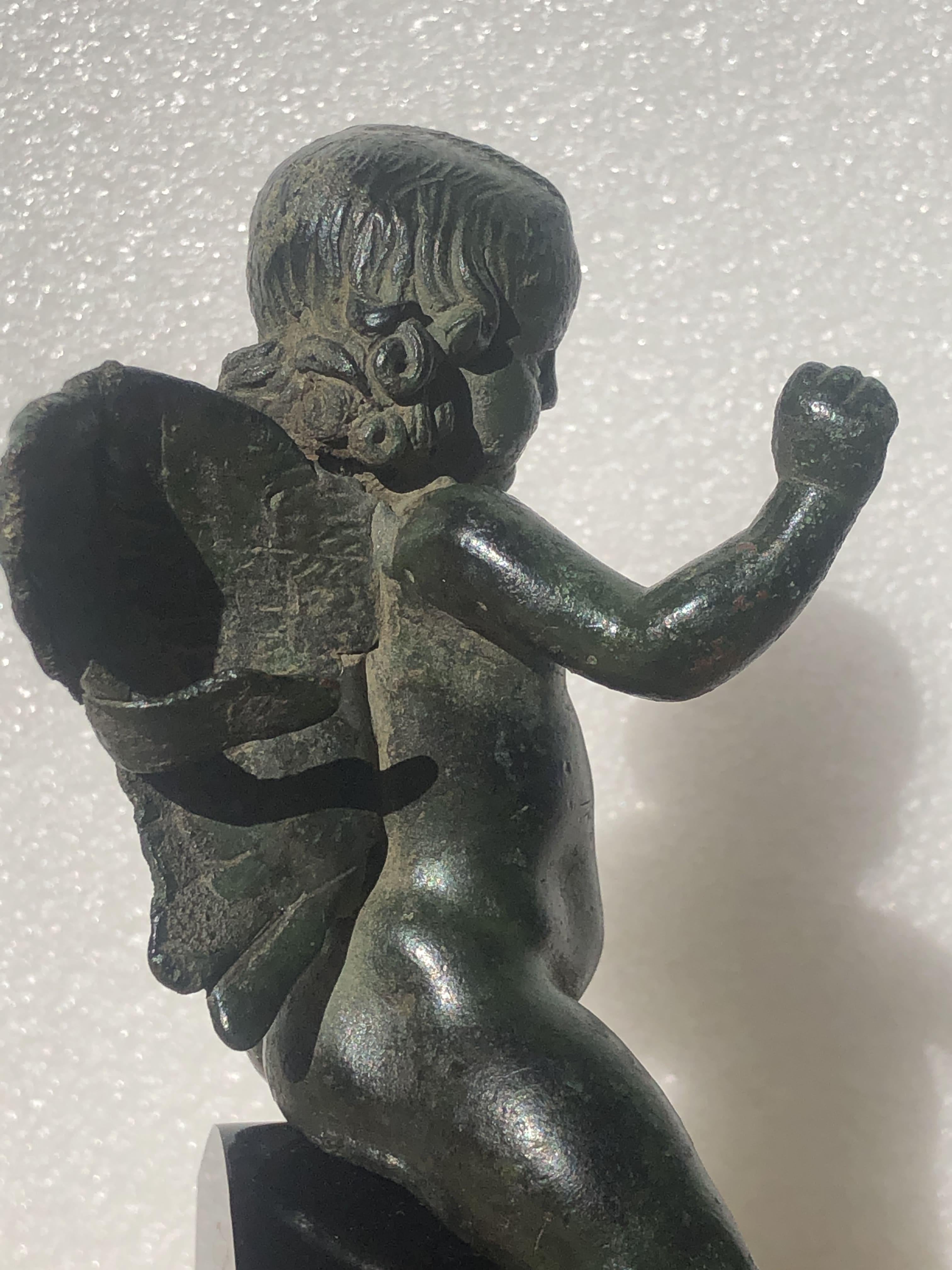 ANCIENT ROMAN BRONZE FIGURE OF WINGED EROS RIDING A DOLPHIN, 2ND CENTURY AD For Sale 3