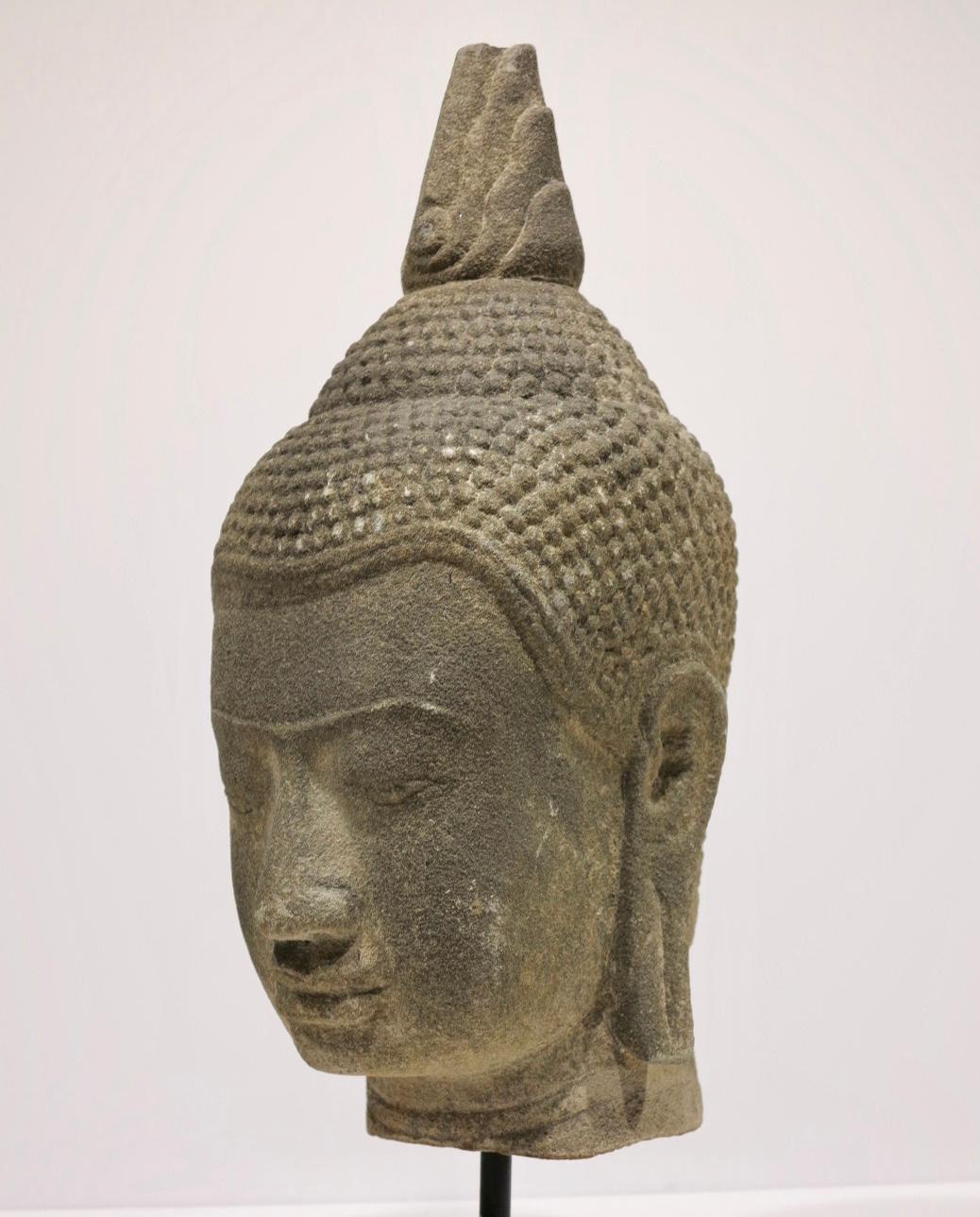 Sandstone head of Buddha, Khmer, Angkor period, post-Bayon - Gray Figurative Sculpture by Unknown